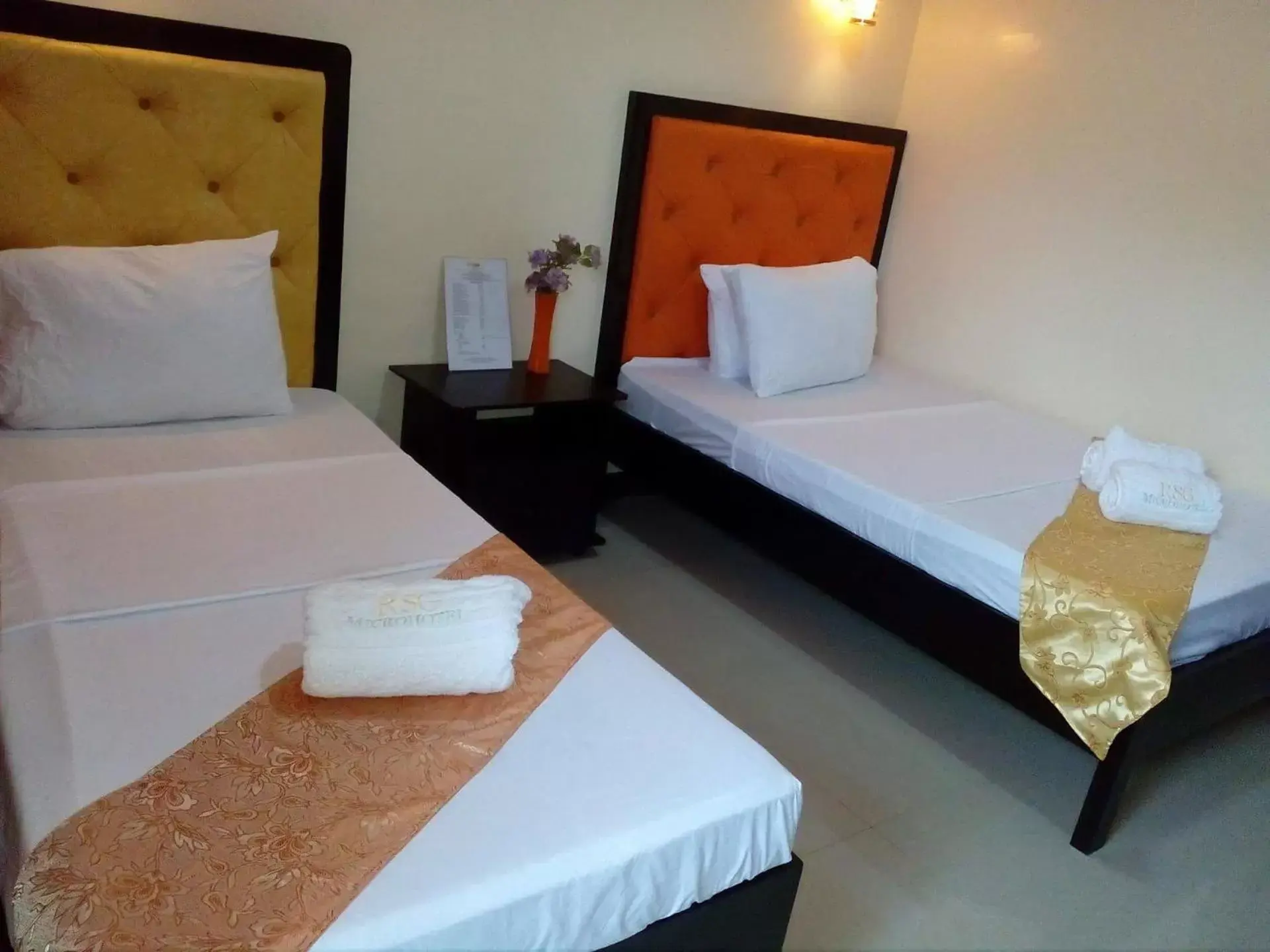 Photo of the whole room, Bed in RSG Microhotel