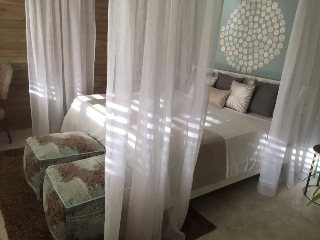 Bed in Mahona Boutique Hotel