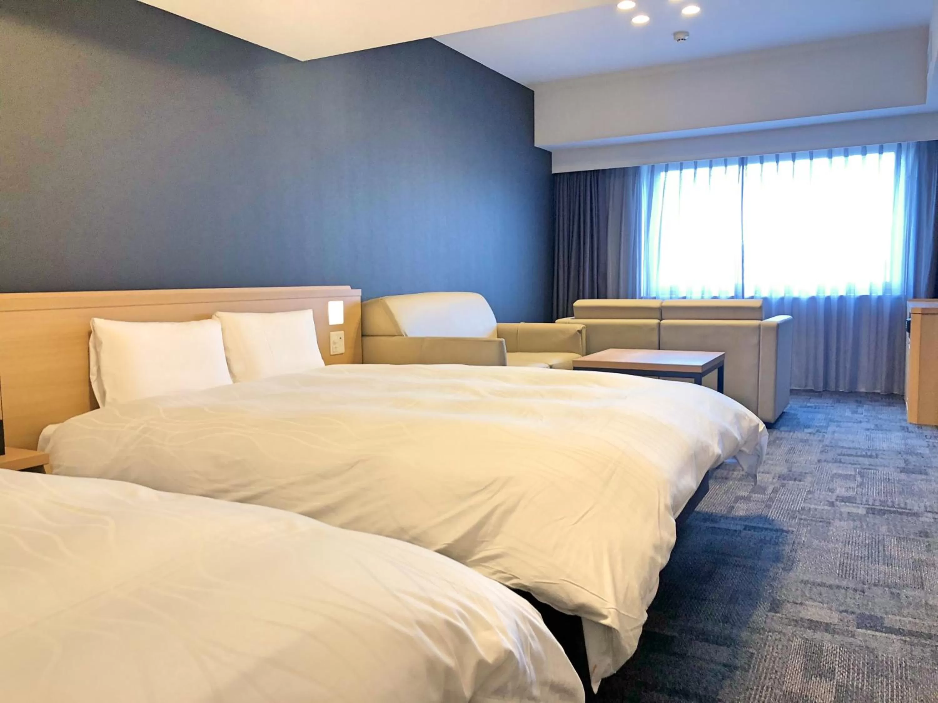 Bed in La Vista Furano Hills Natural Hot Spring