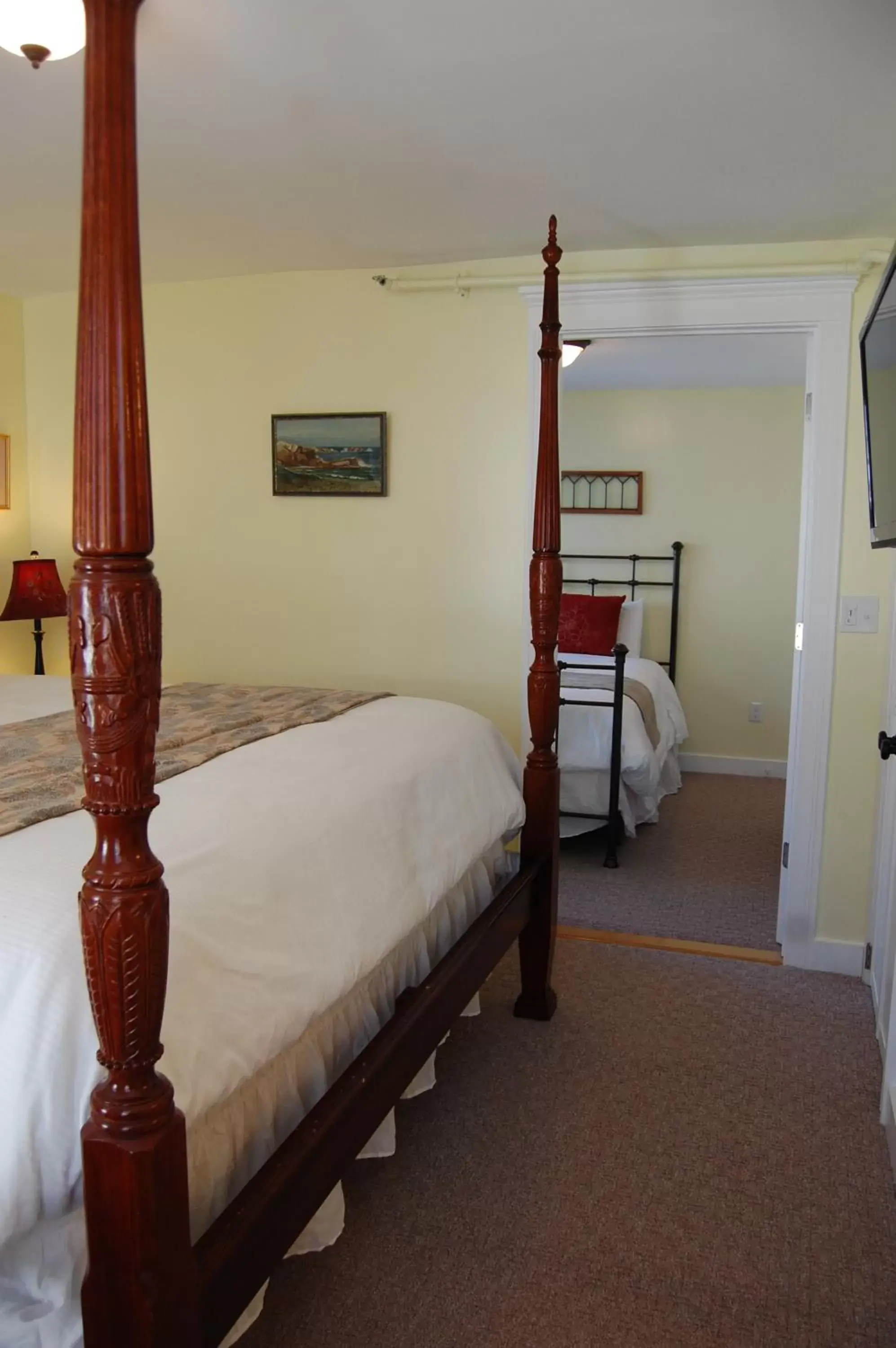 Bed in Cranmore Inn and Suites, a North Conway boutique hotel