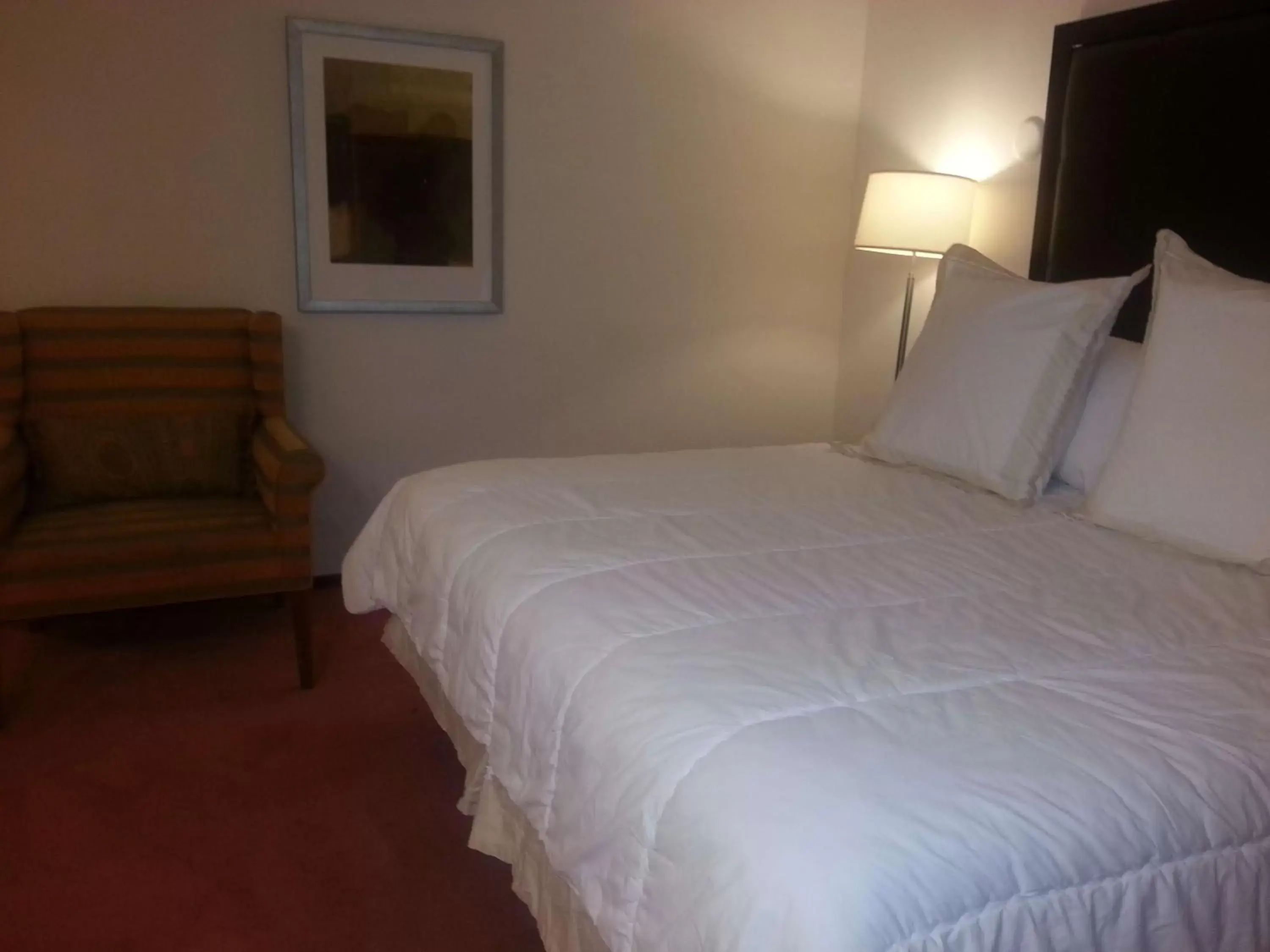 Photo of the whole room, Bed in Harlan Inn and Suites