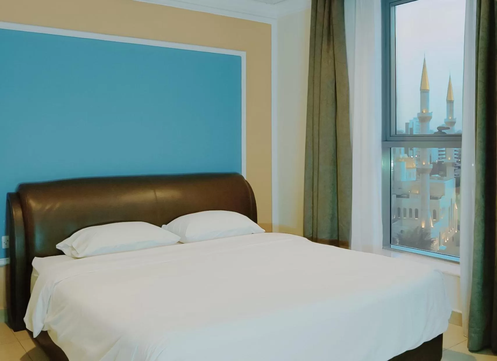 Bed in Laguna Hotel Suites