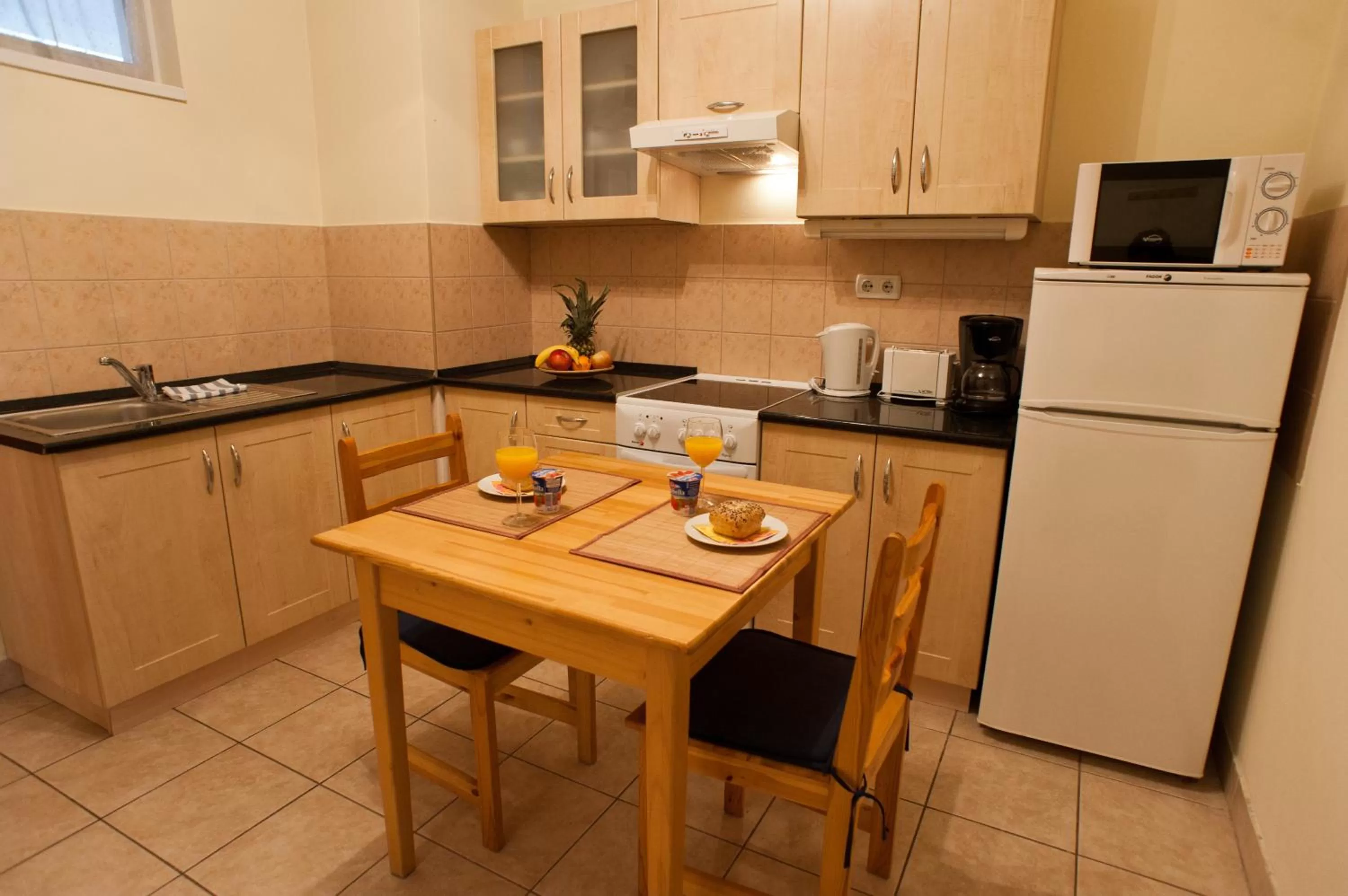 Kitchen or kitchenette in Agape Apartments