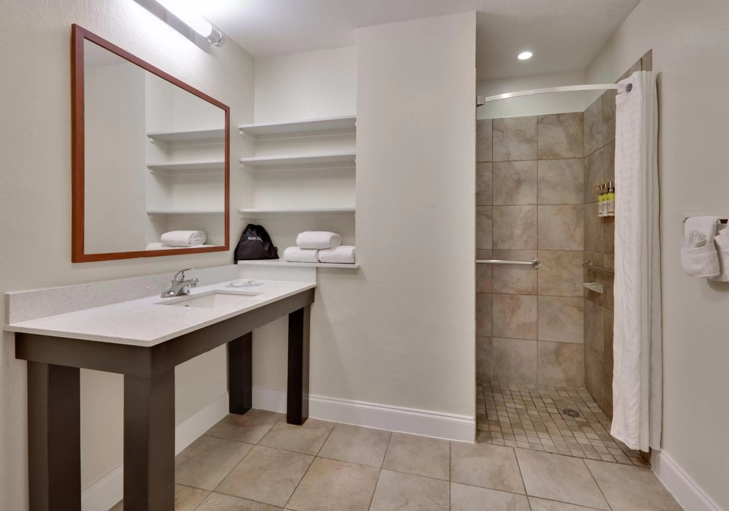 Bathroom in Candlewood Suites Dallas Market Center-Love Field by IHG