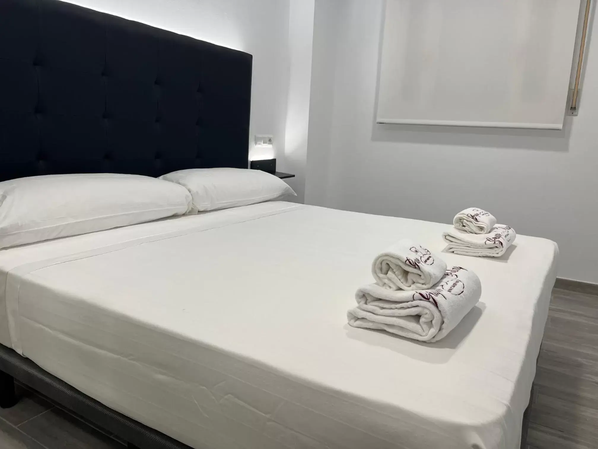 Bed in H Pelayo Auto Check-In Rooms