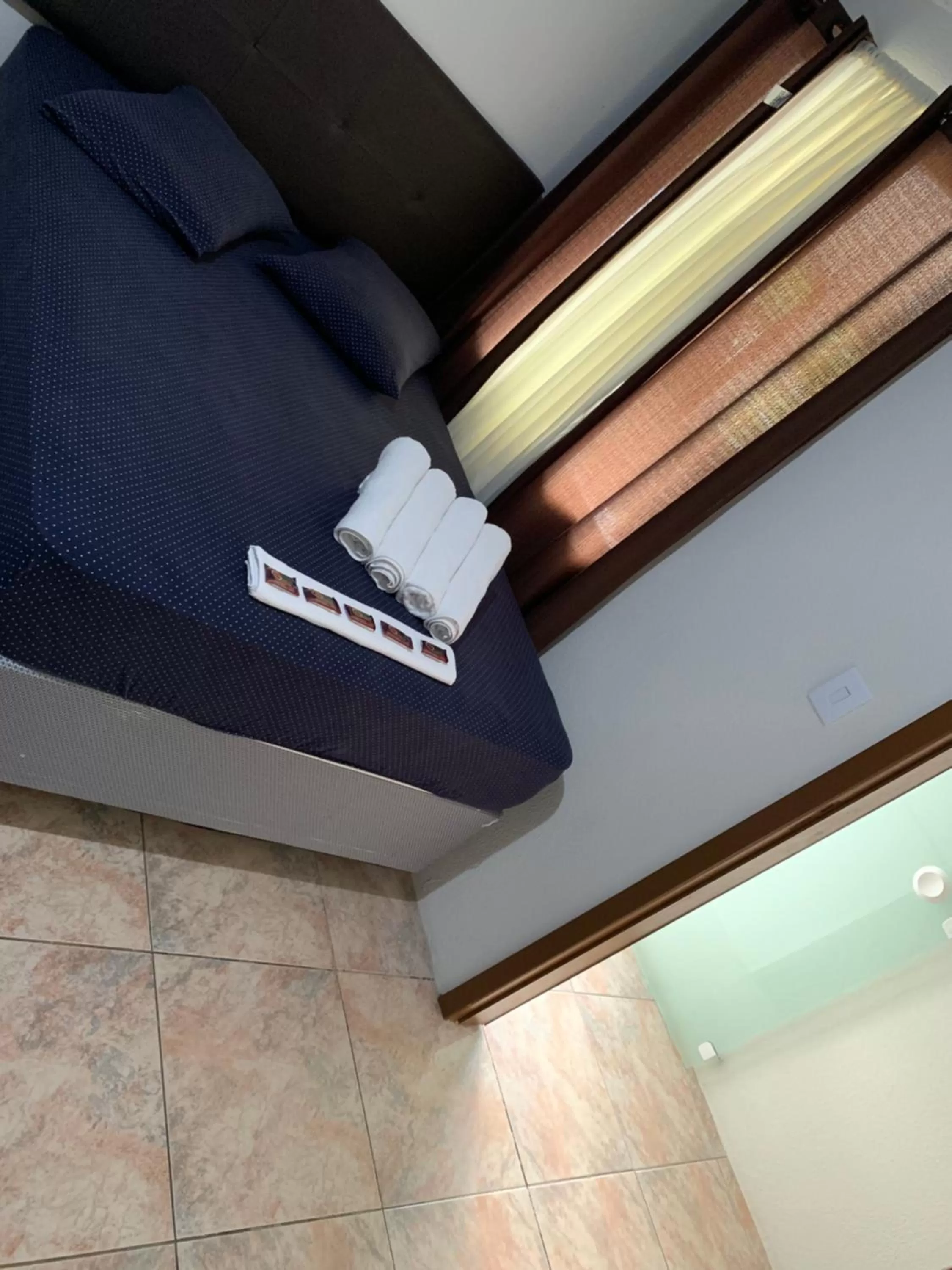 Bed, TV/Entertainment Center in Pousada Tio Tonho