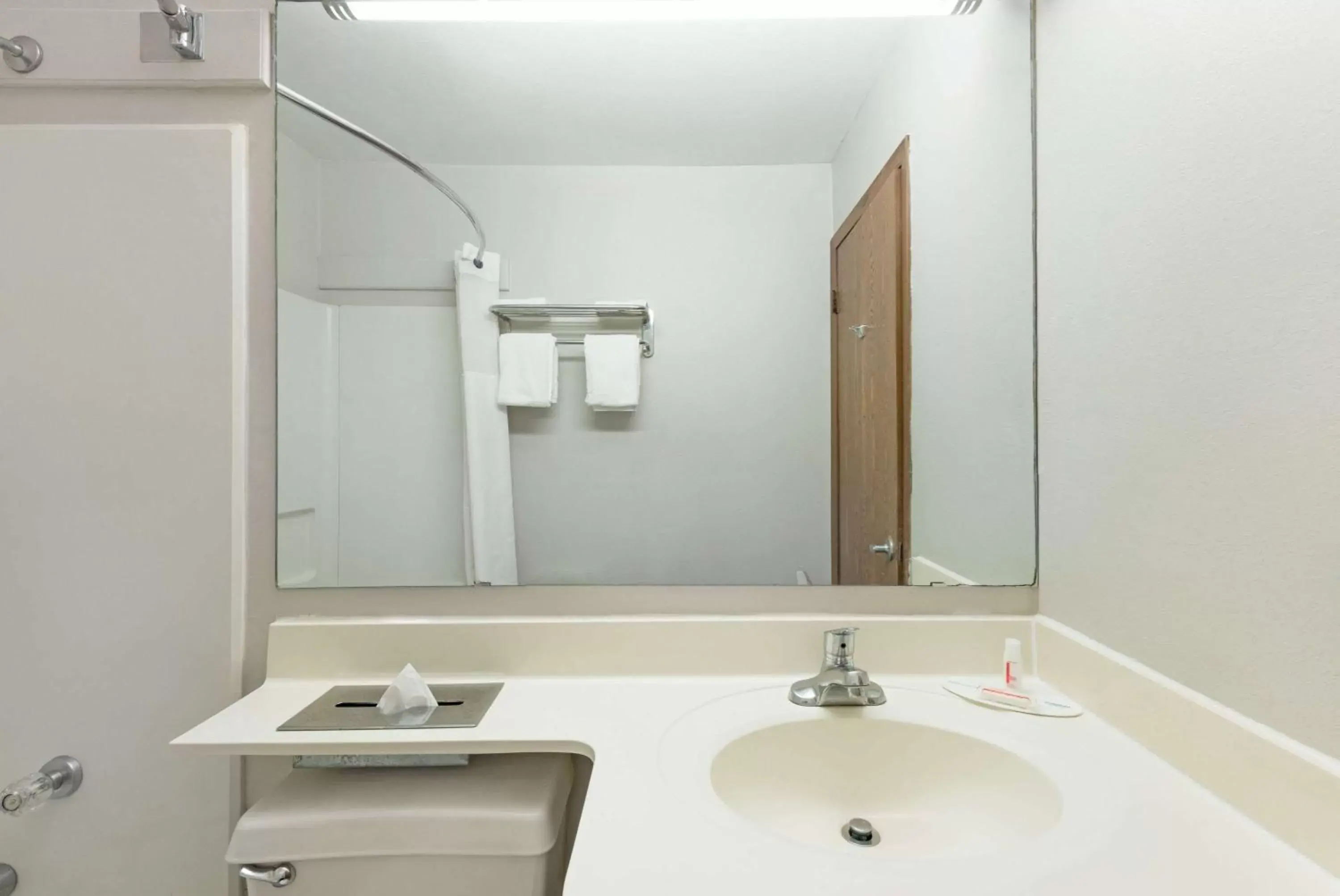 Bathroom in Microtel Inn by Wyndham Henrietta