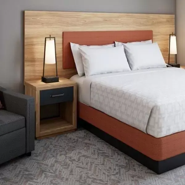 Bed in Candlewood Suites-Augusta, an IHG Hotel