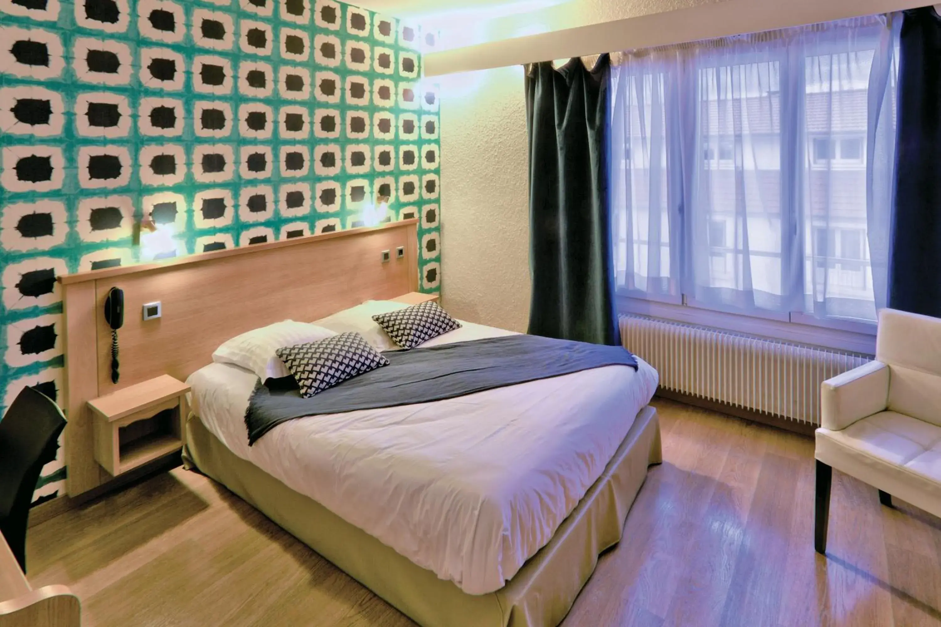 Bed in Logis Hotel Restaurant Spa Beau Site Bed in Logis Hotel Restaurant Spa Beau Site