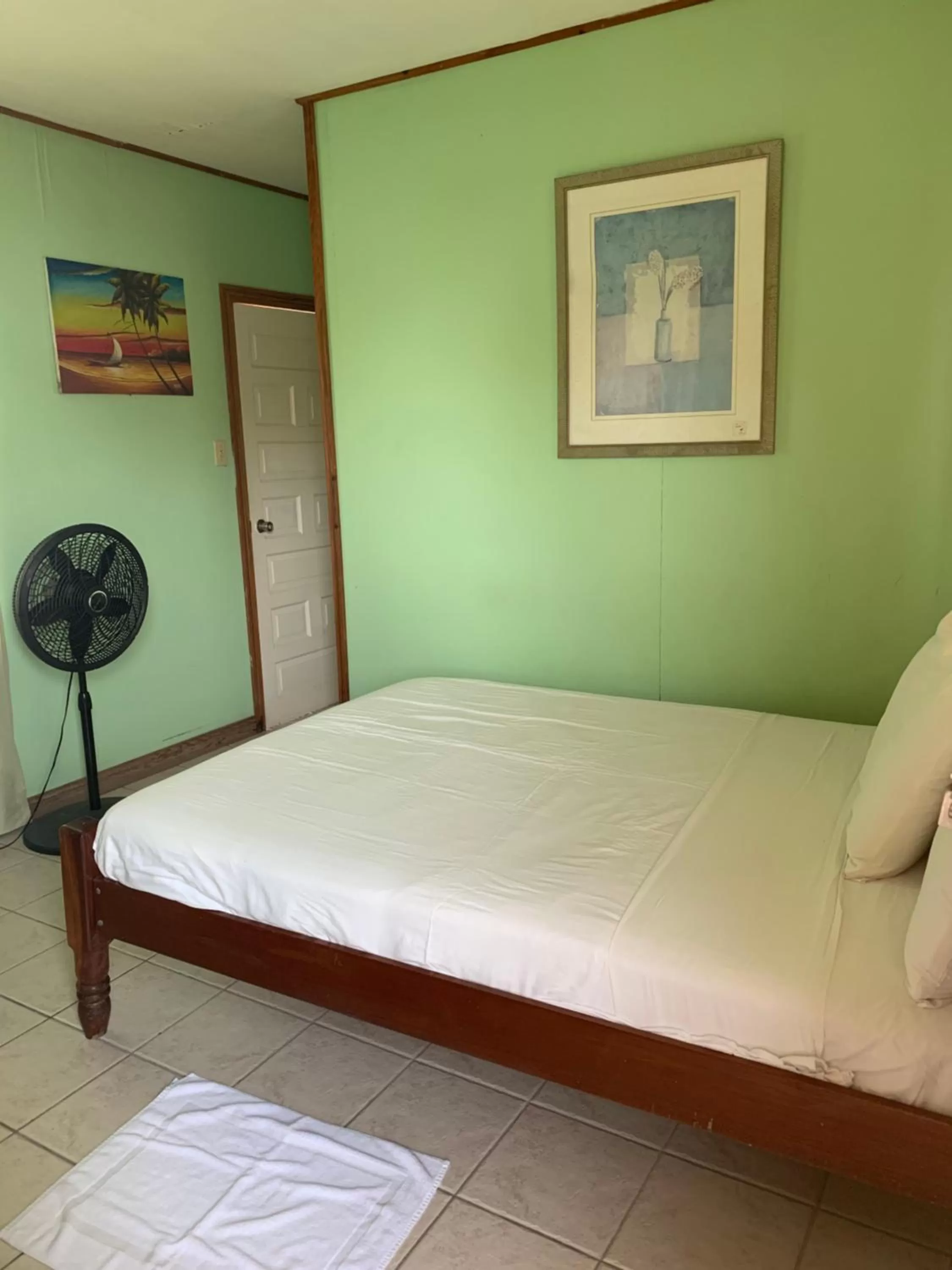 Bed in Blue Wave Guest House