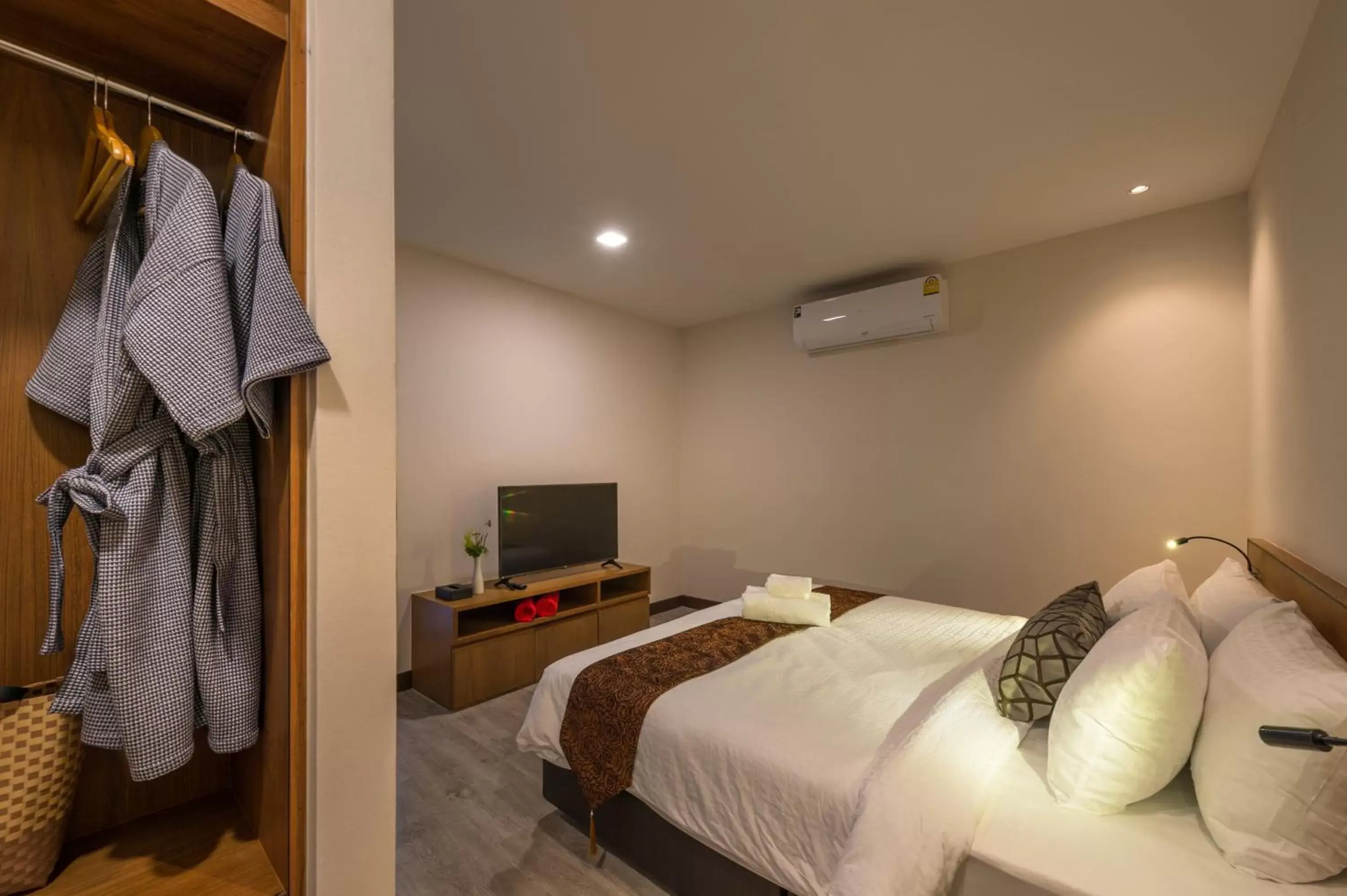 Bed in Cher​mantra​ Aonang​ Resort & Pool​ Suite