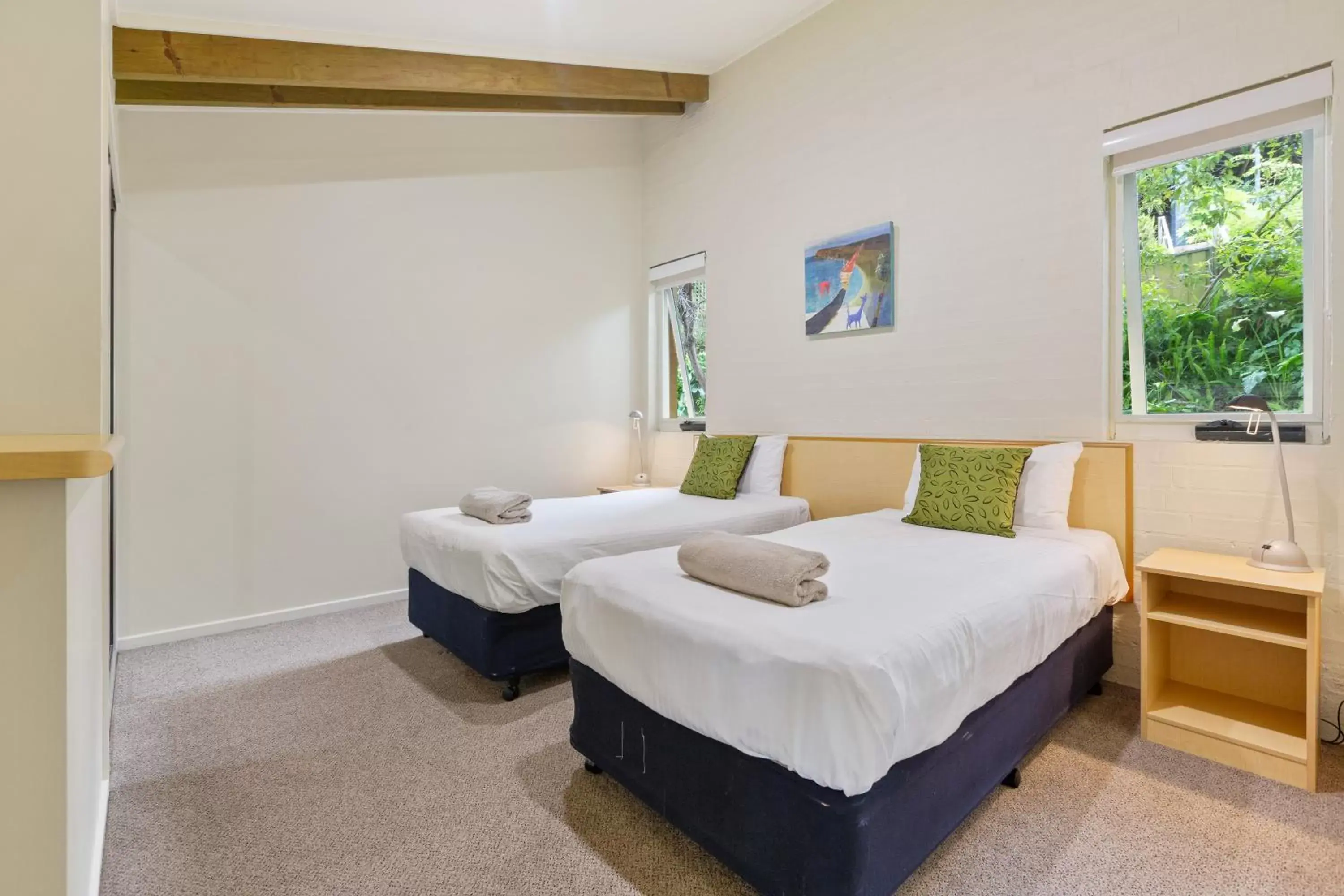 Bed in Tathra Beach House Holiday Apartments