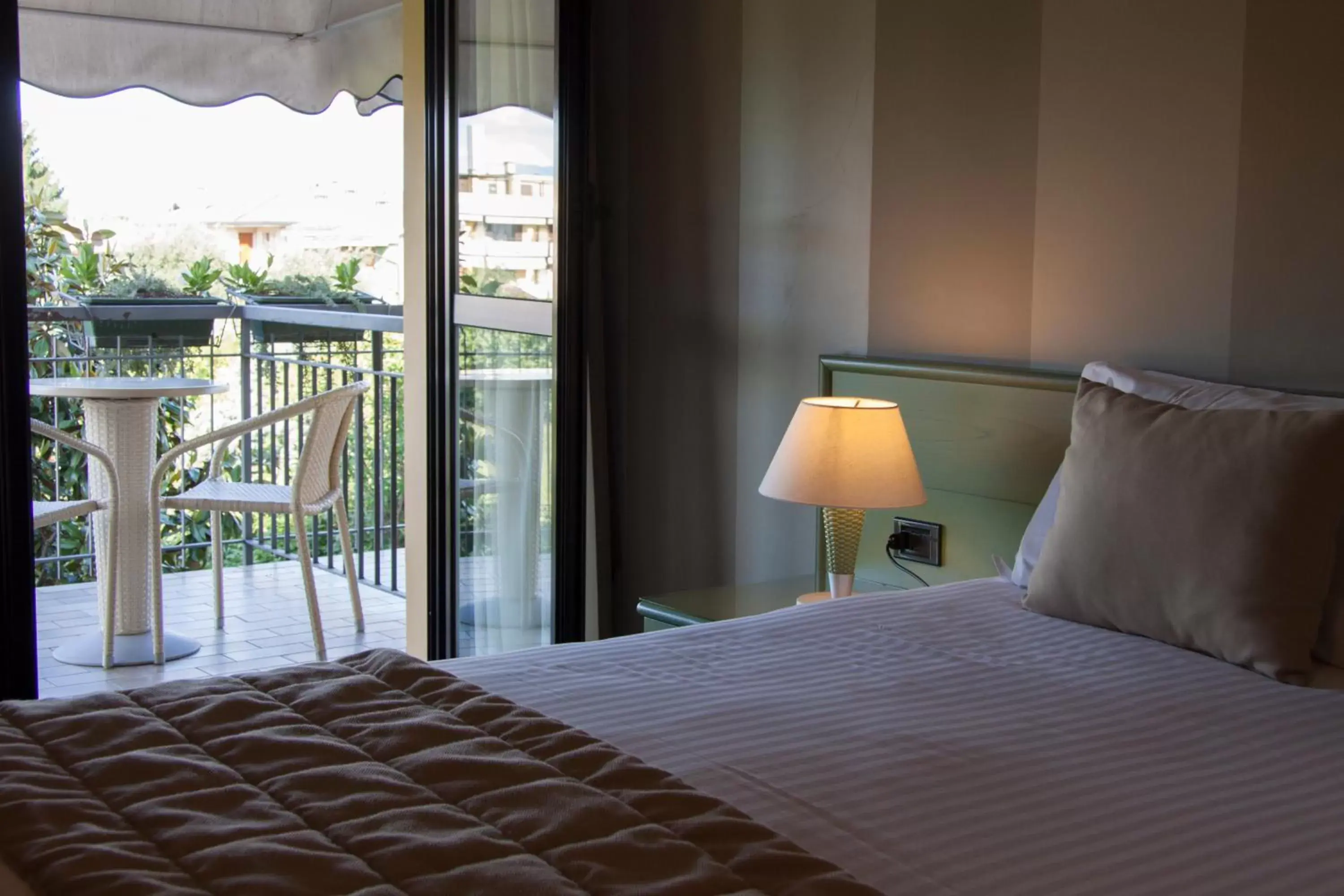 Balcony/Terrace, Bed in Hotel Berta