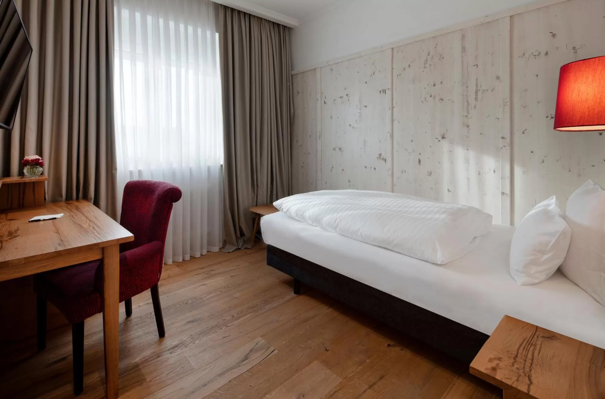 Bed in Eden Hotel Wolff