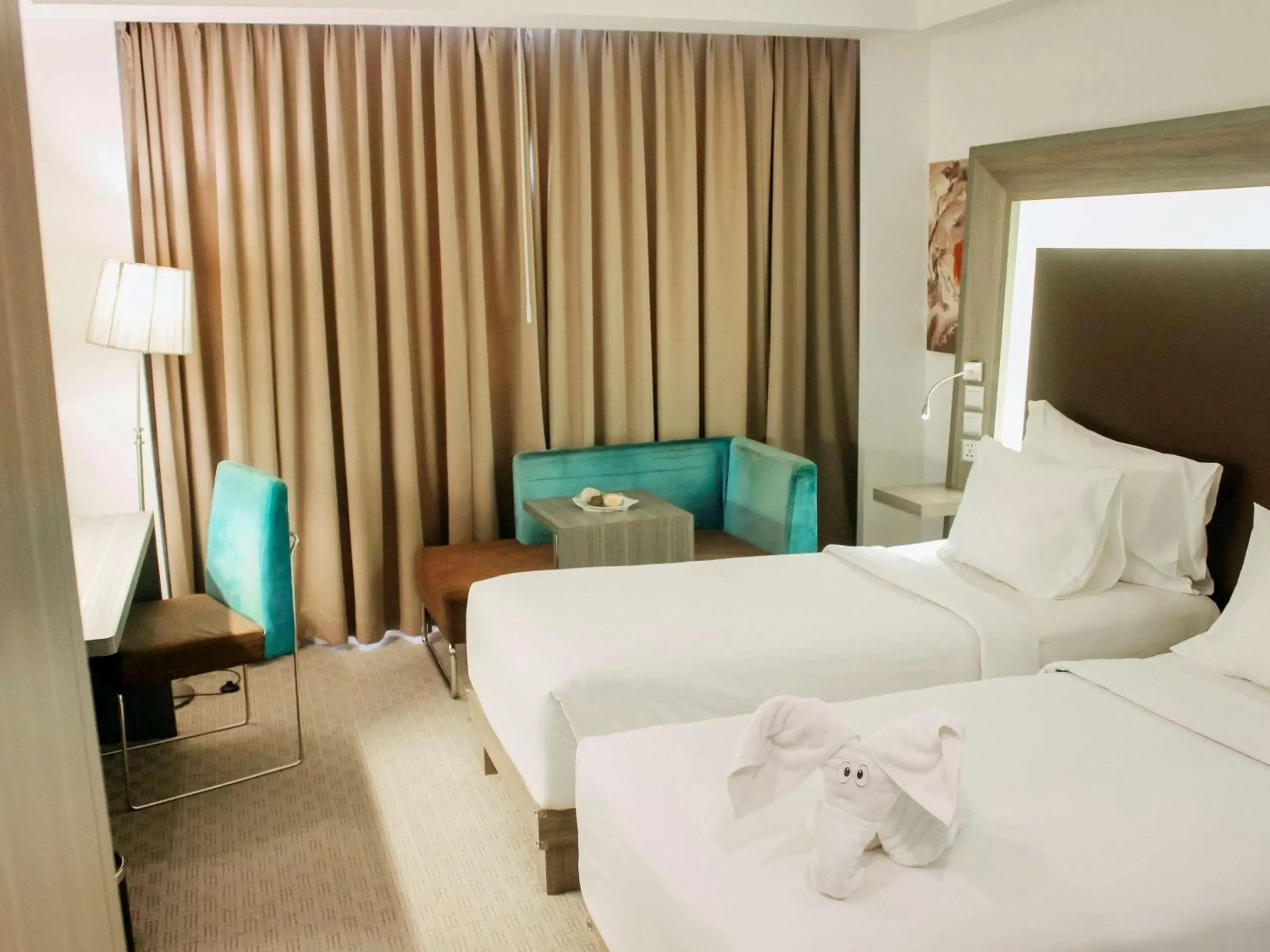 Photo of the whole room, Bed in Novotel Bangka Hotel & Convention Center