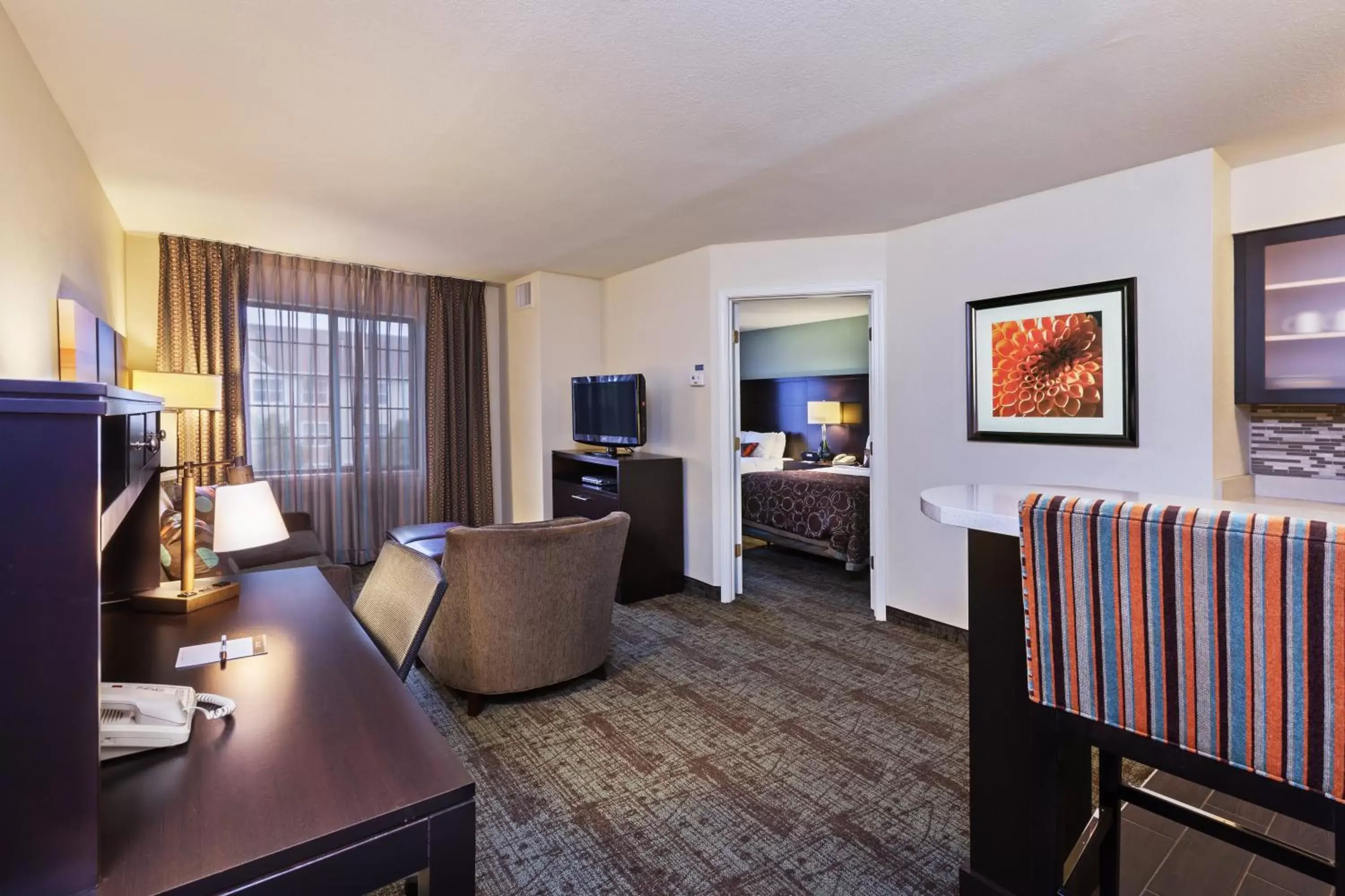 Photo of the whole room, Seating Area in Staybridge Suites Tulsa-Woodland Hills, an IHG Hotel