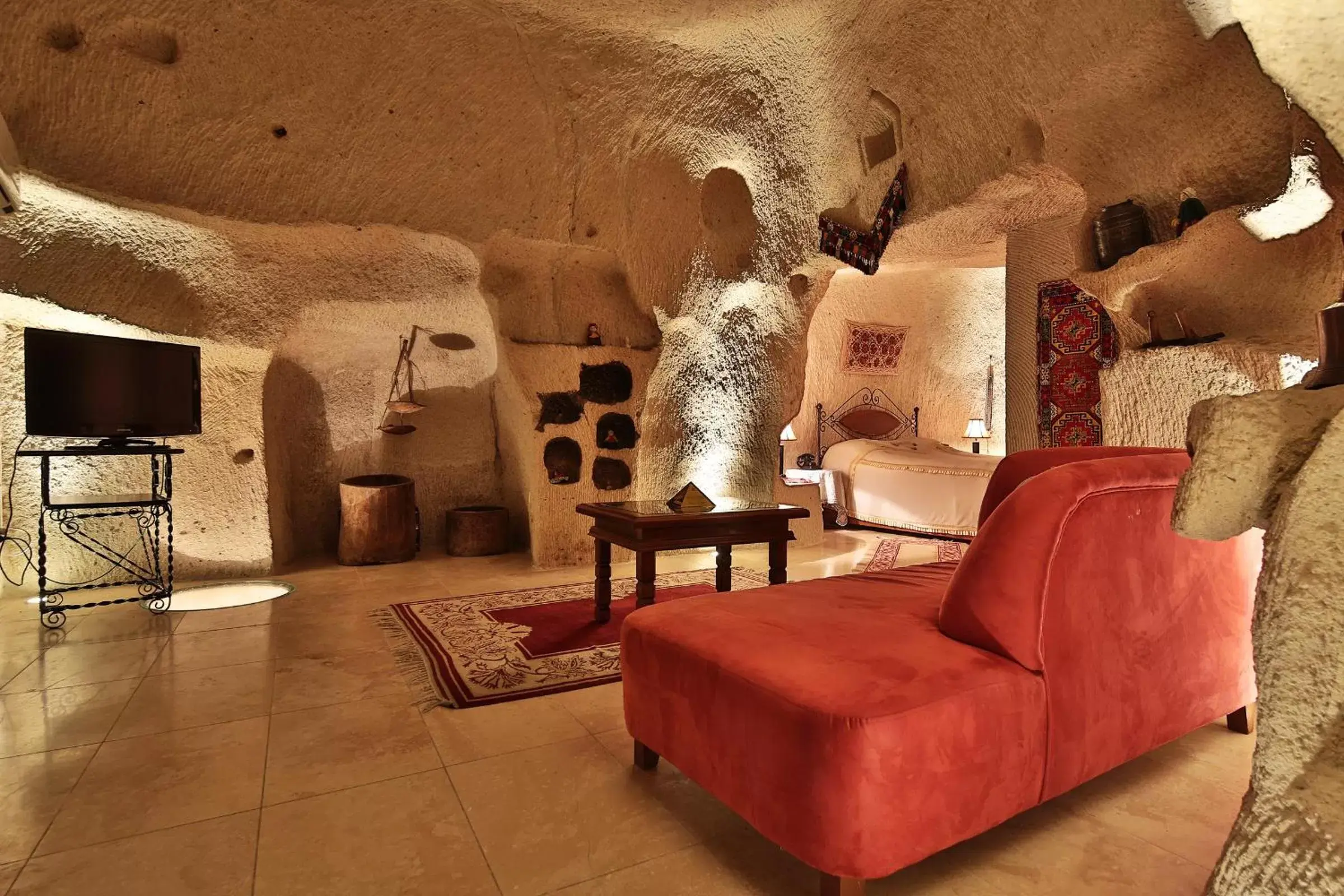 Bed, Seating Area in Cappadocia Cave Suites