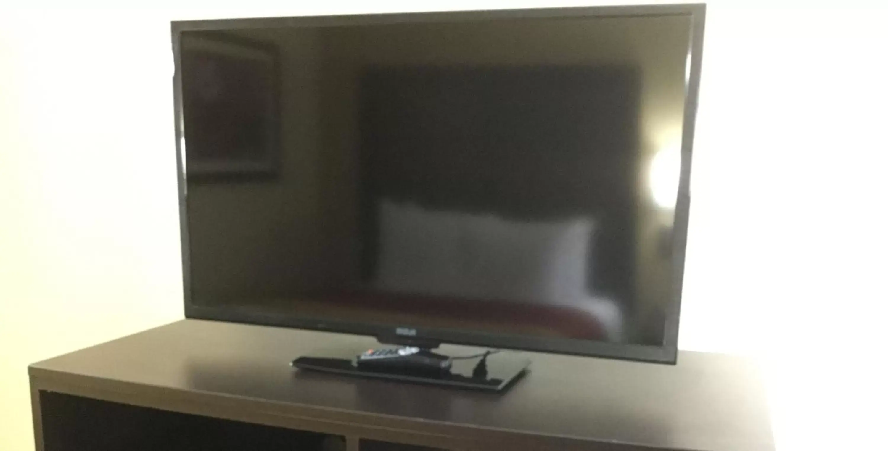 TV/Entertainment Center in Days Inn & Suites by Wyndham Commerce