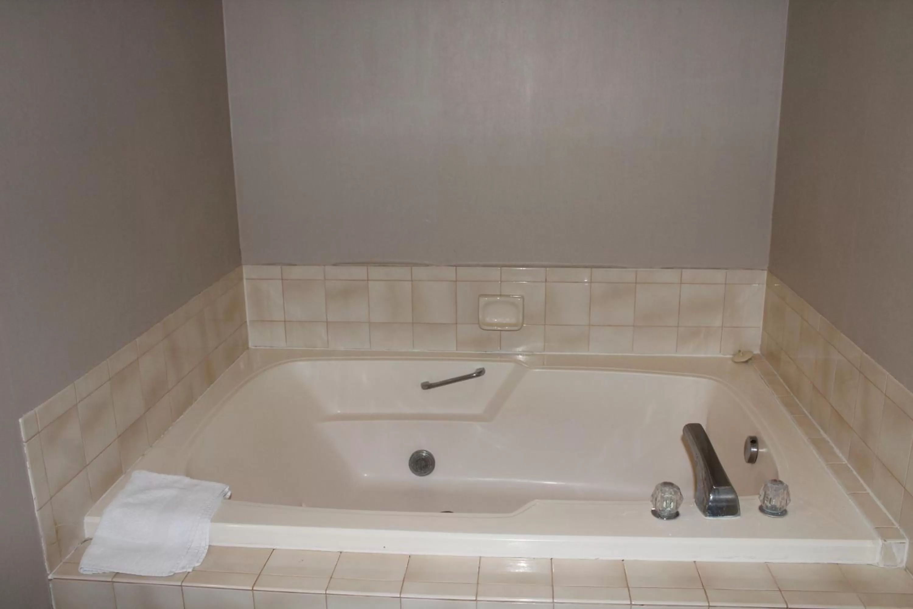 Bedroom in Coratel Inn and Suites Maple Grove