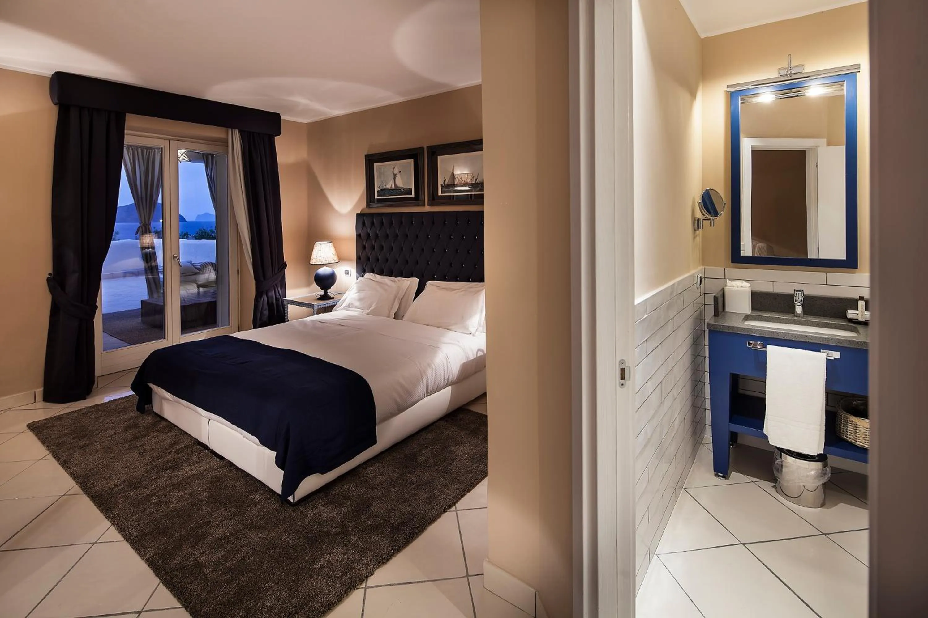 Bed in Therasia Resort Sea and SPA - The Leading Hotels of the World