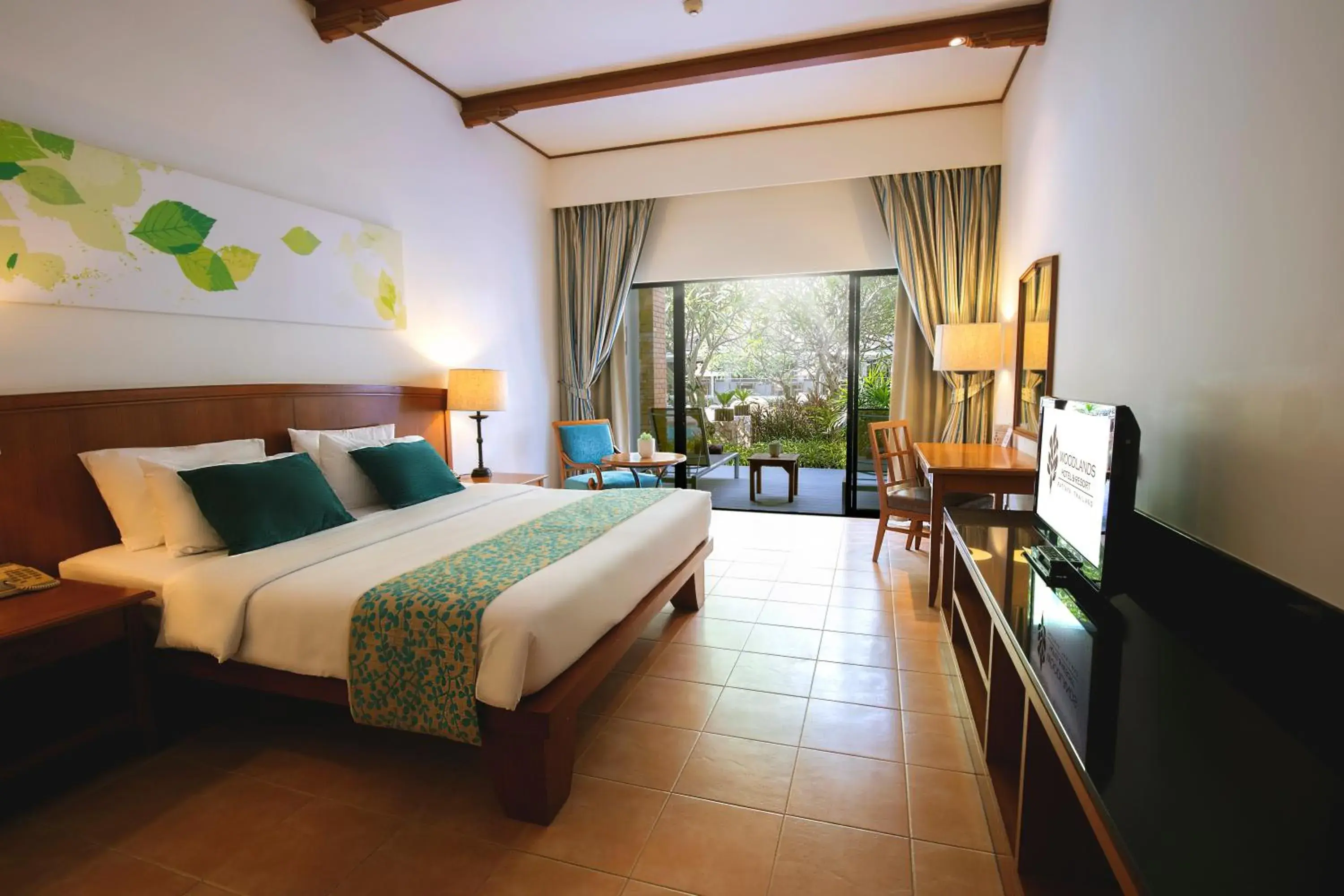 Bedroom in Woodlands Hotel and Resort Pattaya