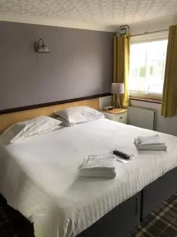 Bed in Boathouse Hotel