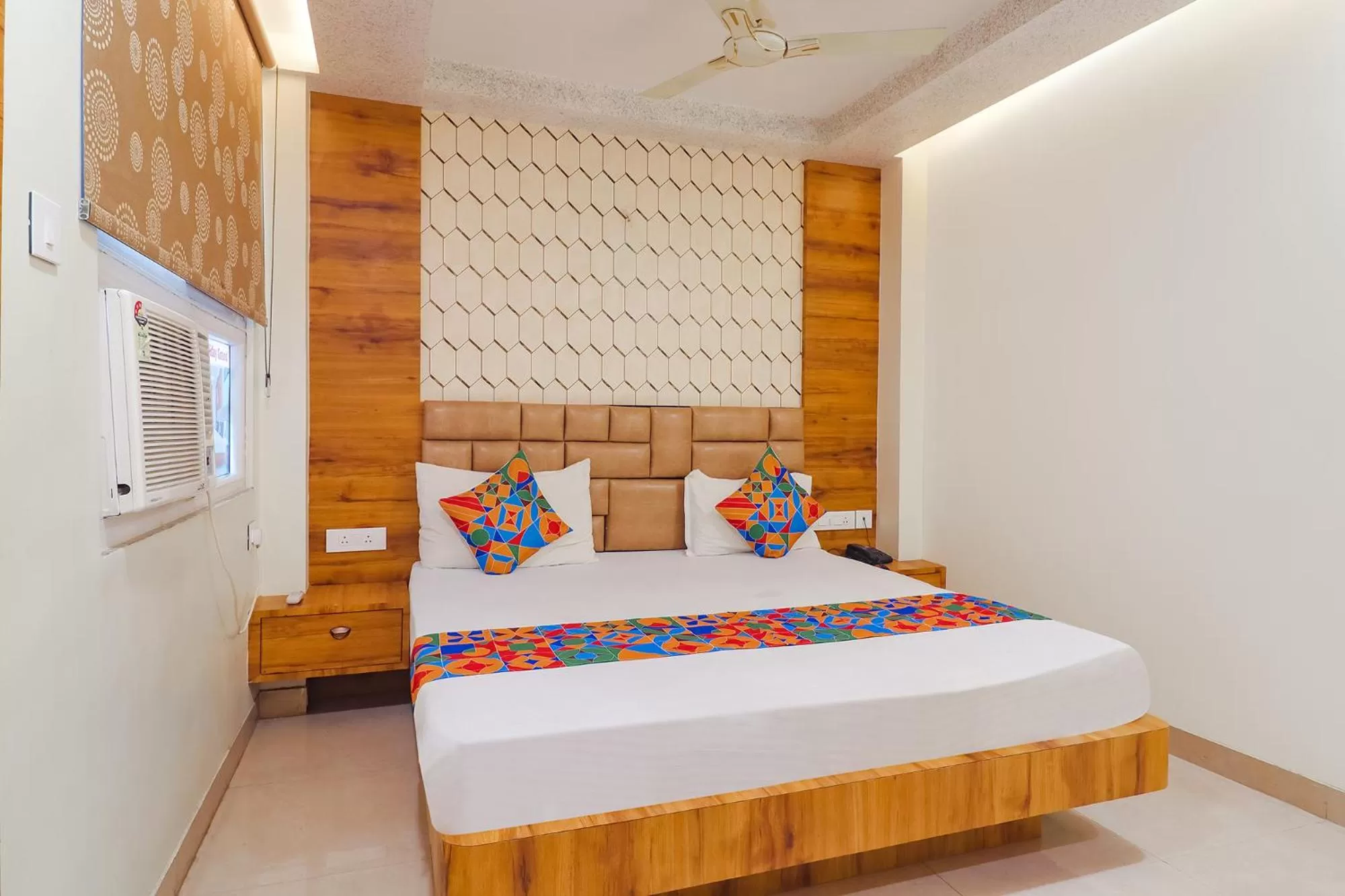 Bed in FabHotel Holiday Grand