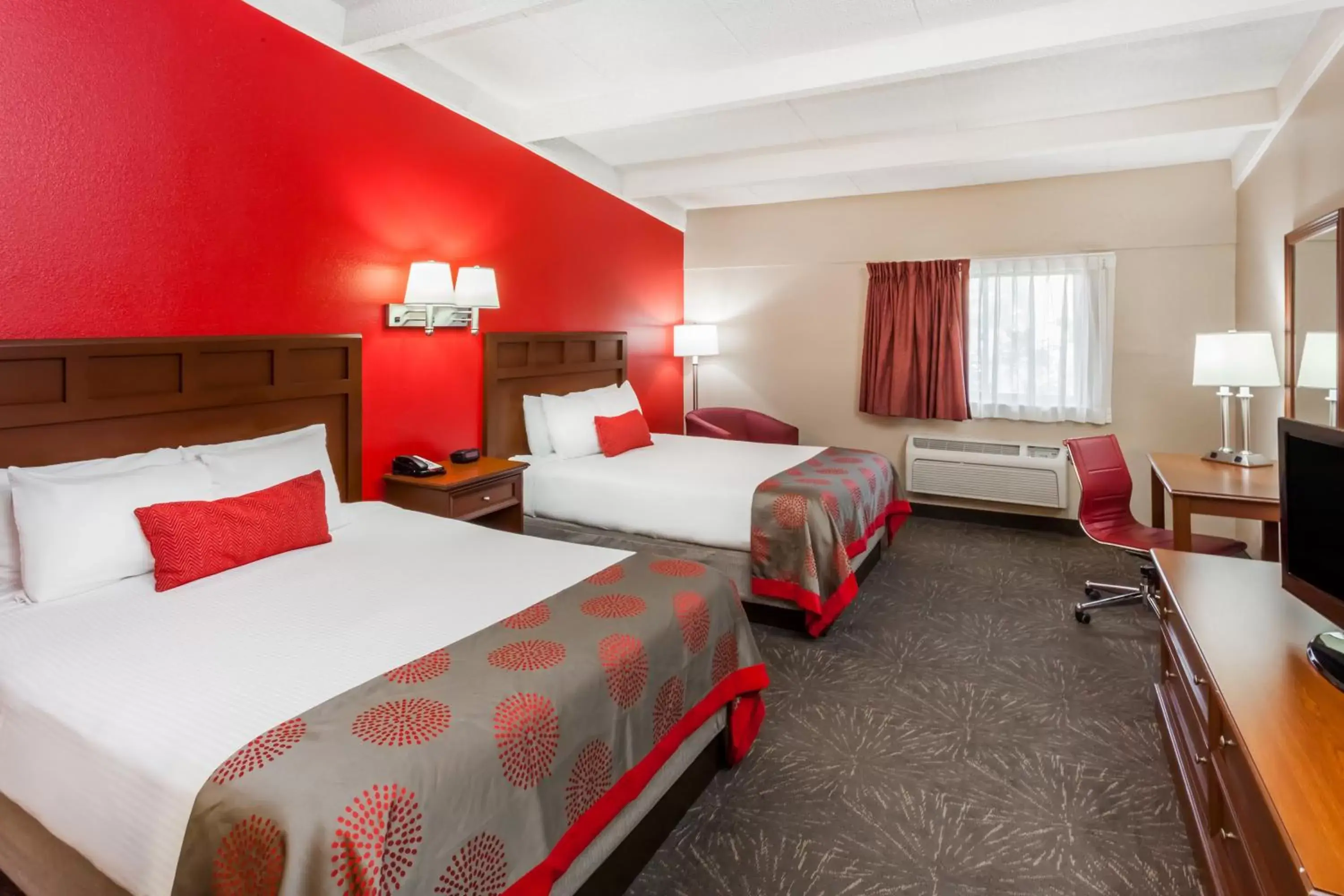 Bed in Ramada by Wyndham Hammond Hotel & Conference Center