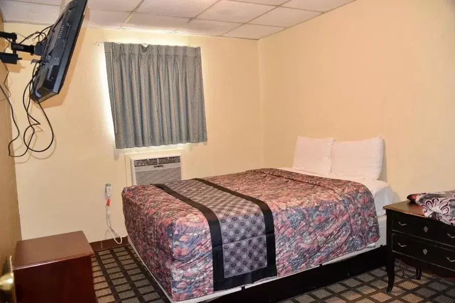Bed in Extended Stay Motel - Snyder