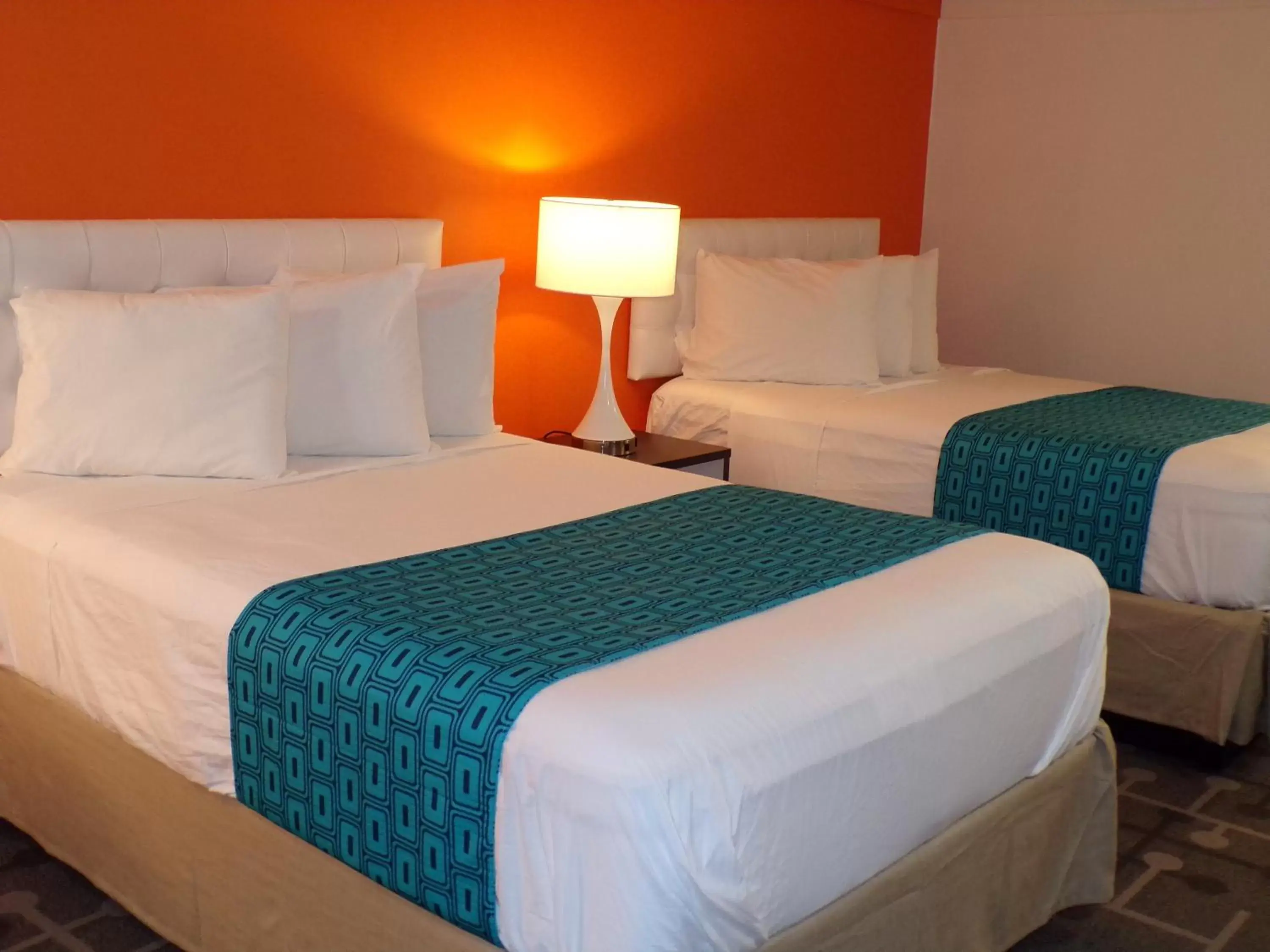 Bed in Dover Inn and Suites