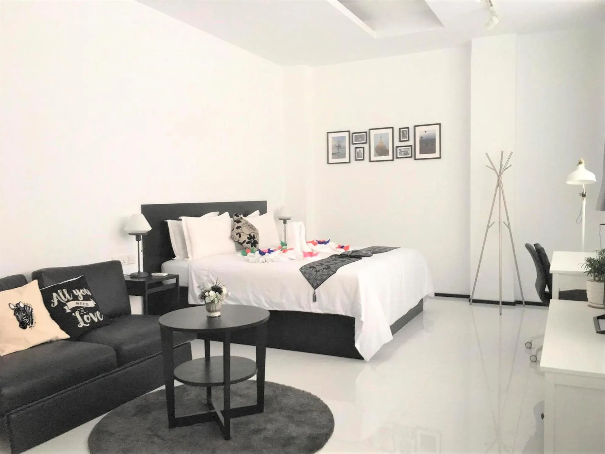 Living room, Bed in YAMA HOTEL & ROOFTOP BAR