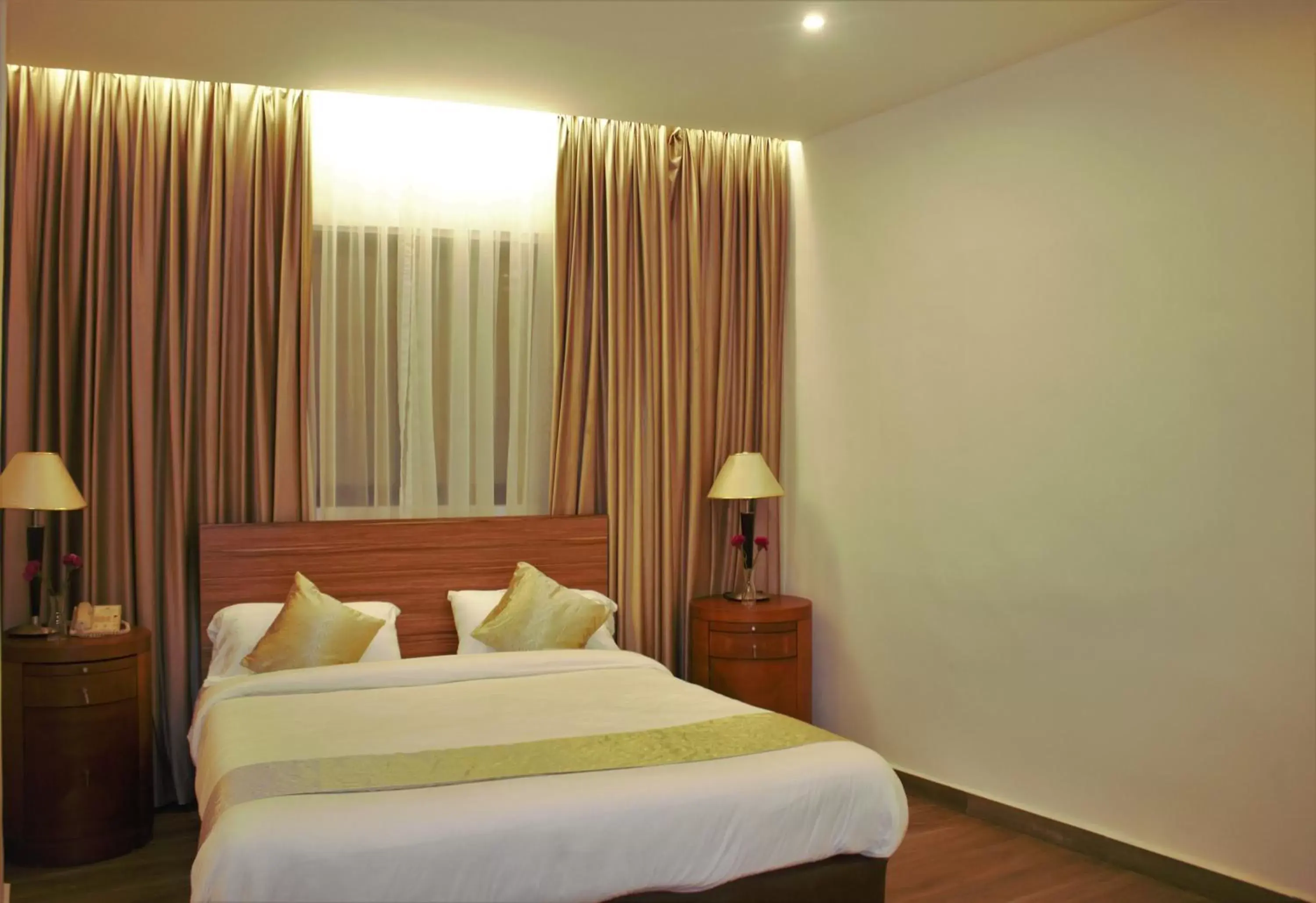 Bed in New MerryLand Hotel Bed in New MerryLand Hotel