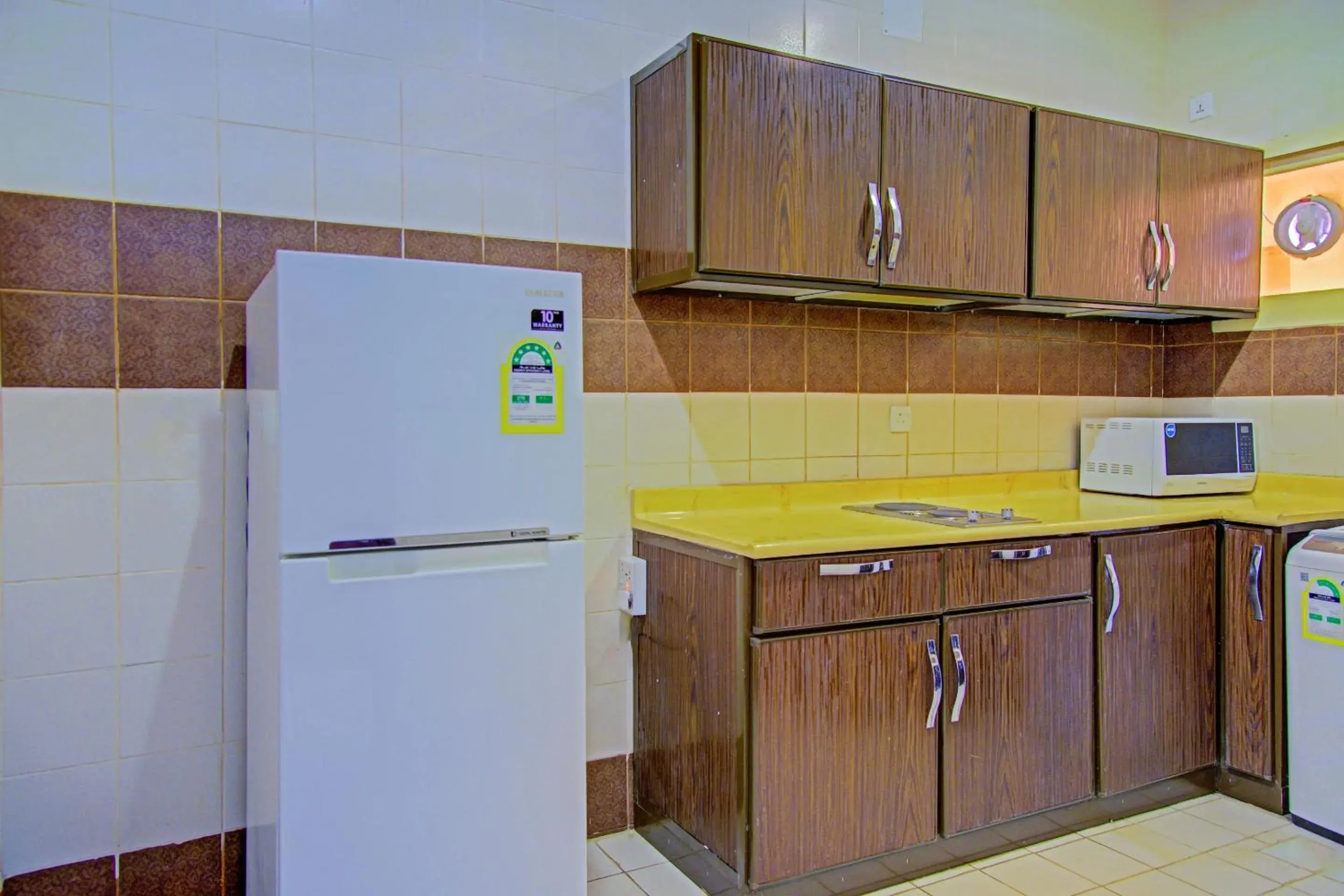 Kitchen or kitchenette, Kitchen/Kitchenette in OYO 401 Al Zaidan For Furnished Units