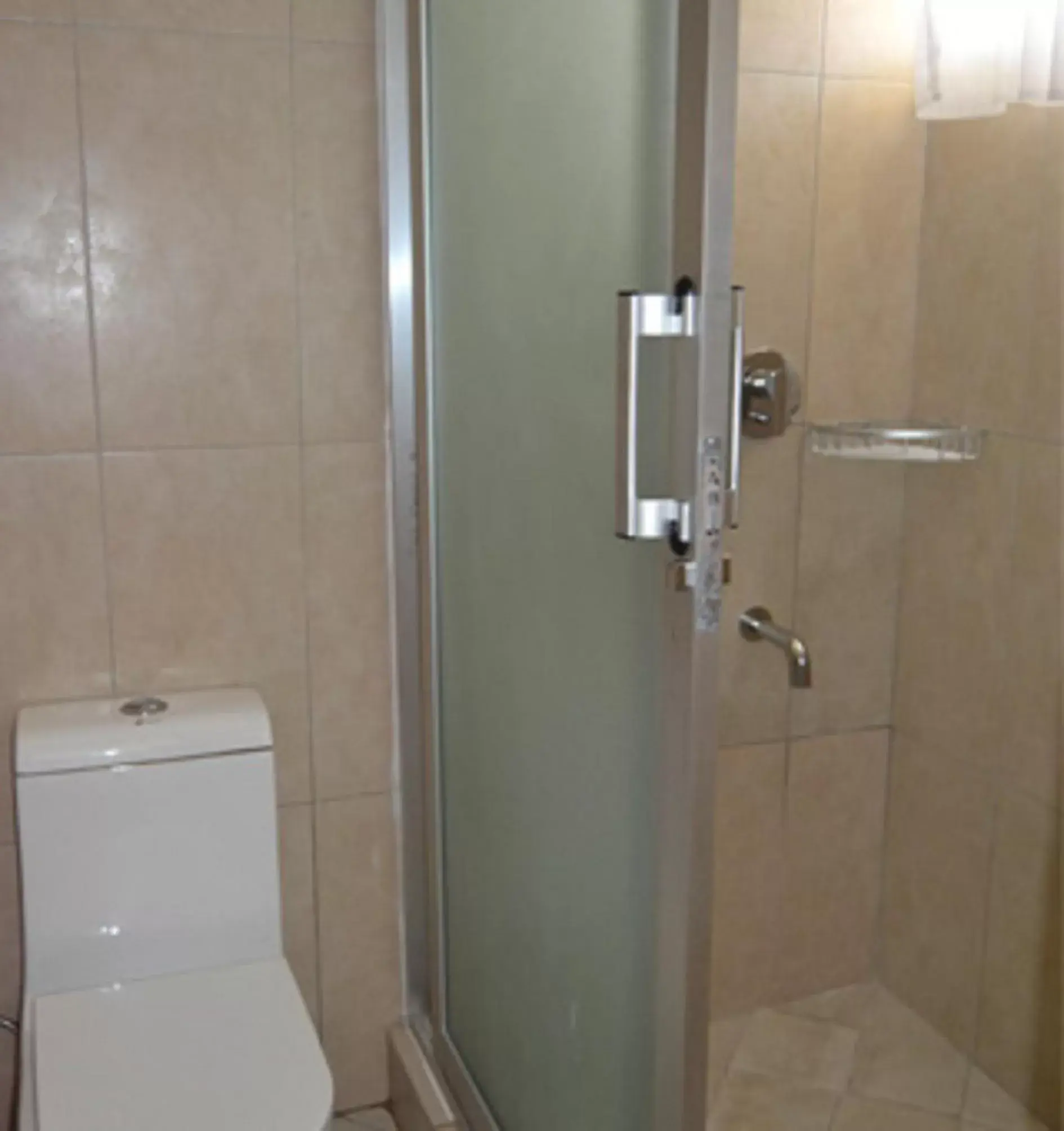 Toilet, Bathroom in Serene Beach Resort Toilet, Bathroom in Serene Beach Resort