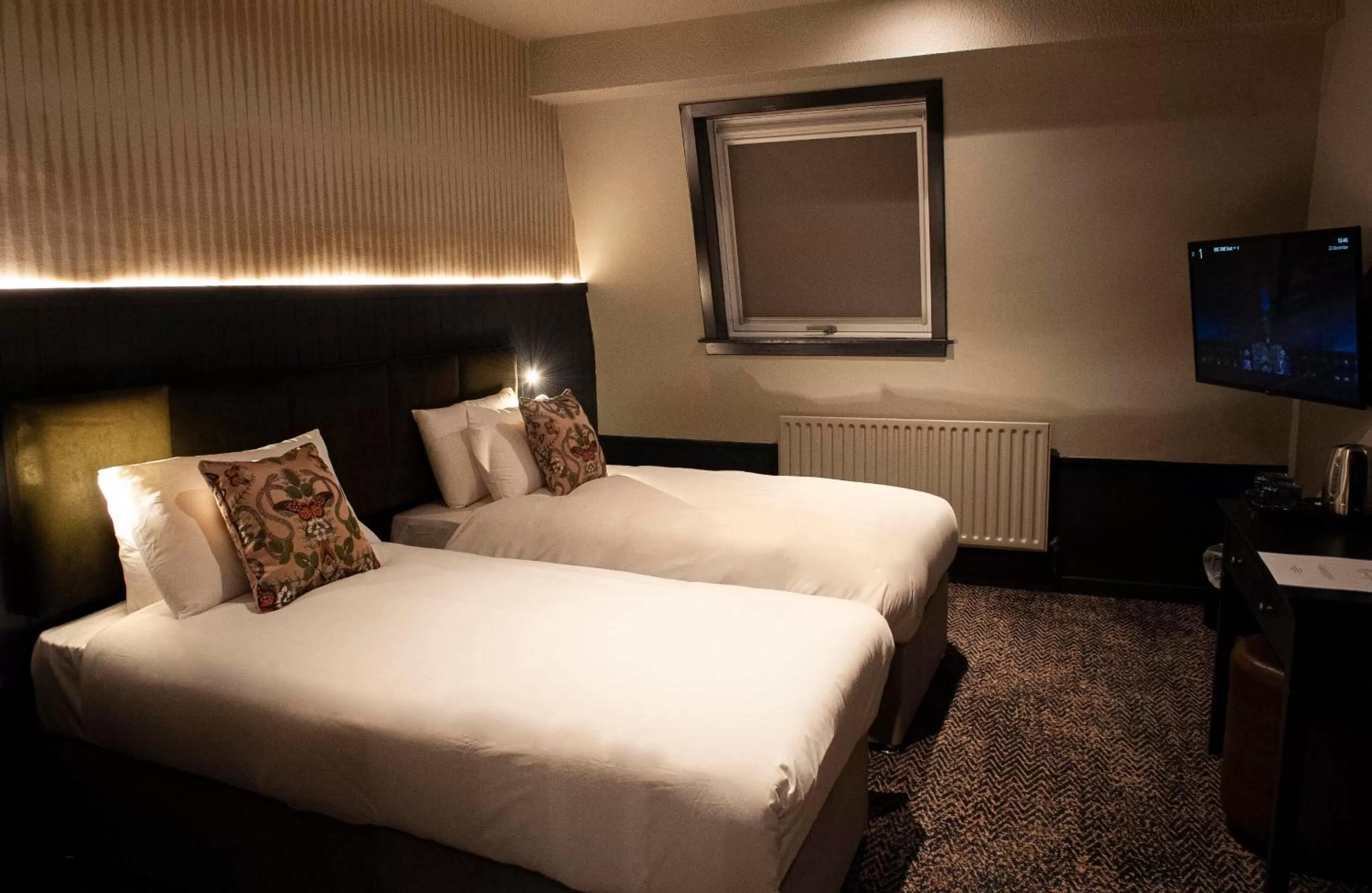 Bed in The Coachman Hotel