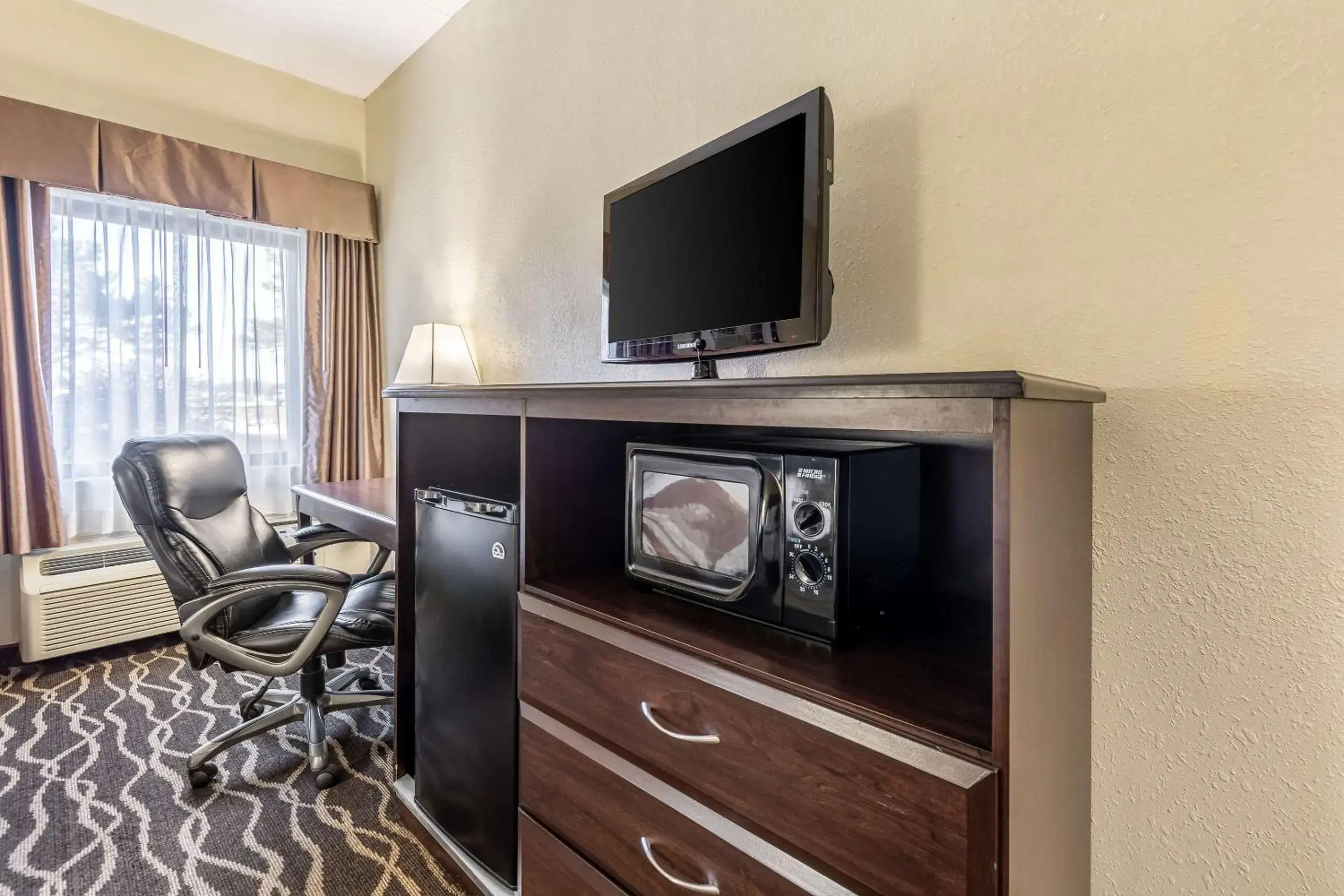 Photo of the whole room, TV/Entertainment Center in Quality Inn & Suites Southport