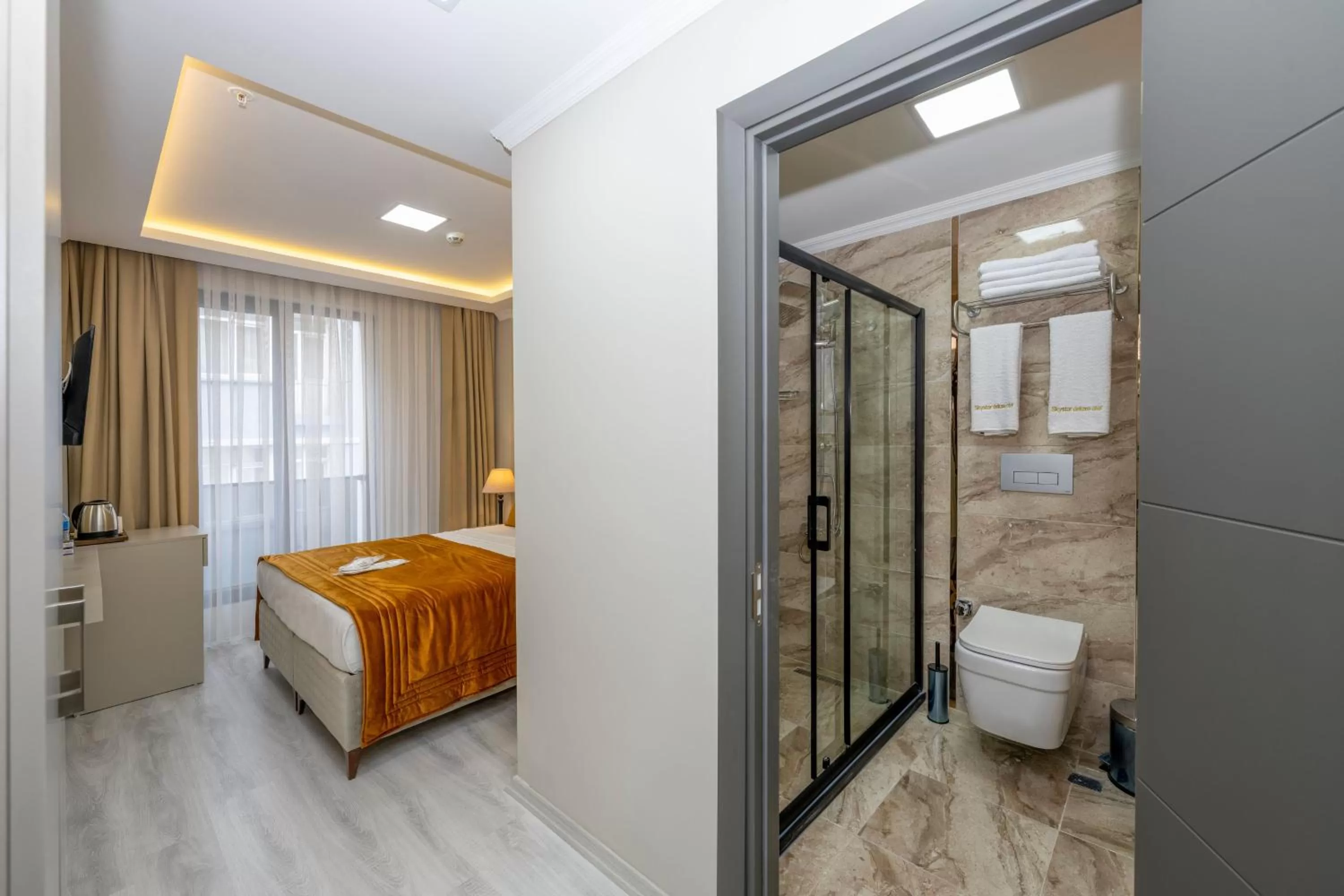 Bed in SKYSTAR DELUXE HOTEL