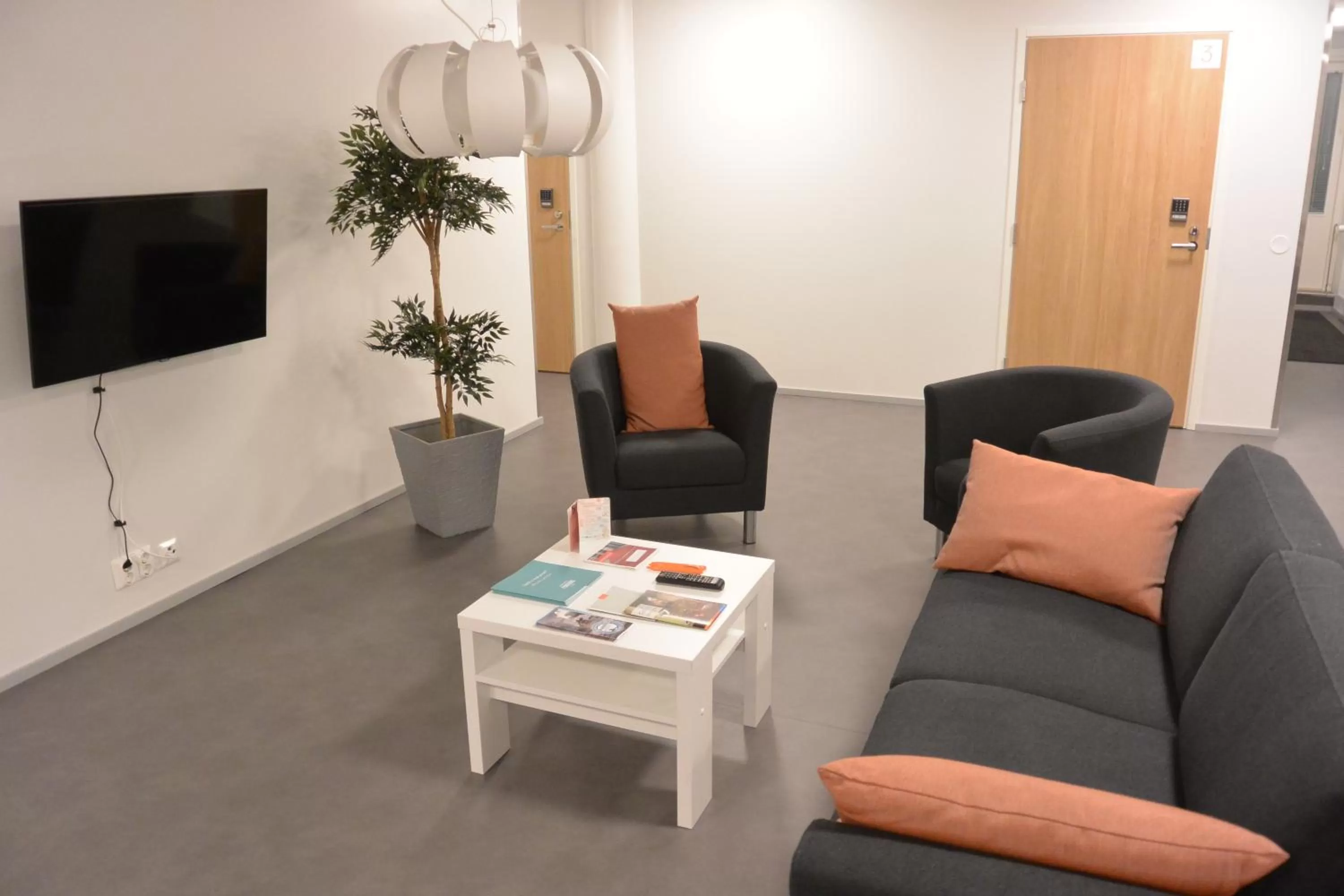 Communal lounge/ TV room in Forenom Aparthotel Raahe