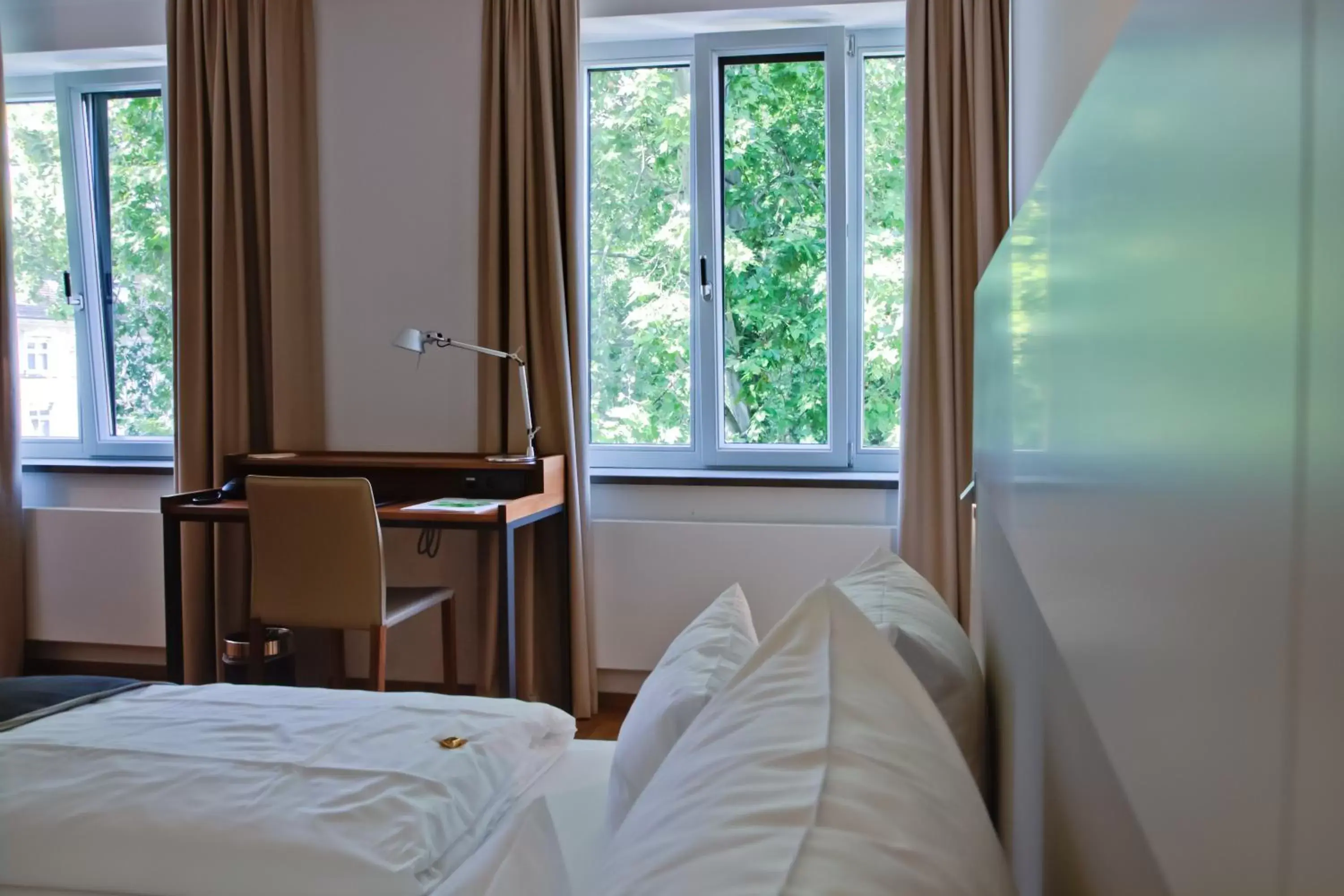 Bed in Qube Hotel Bergheim