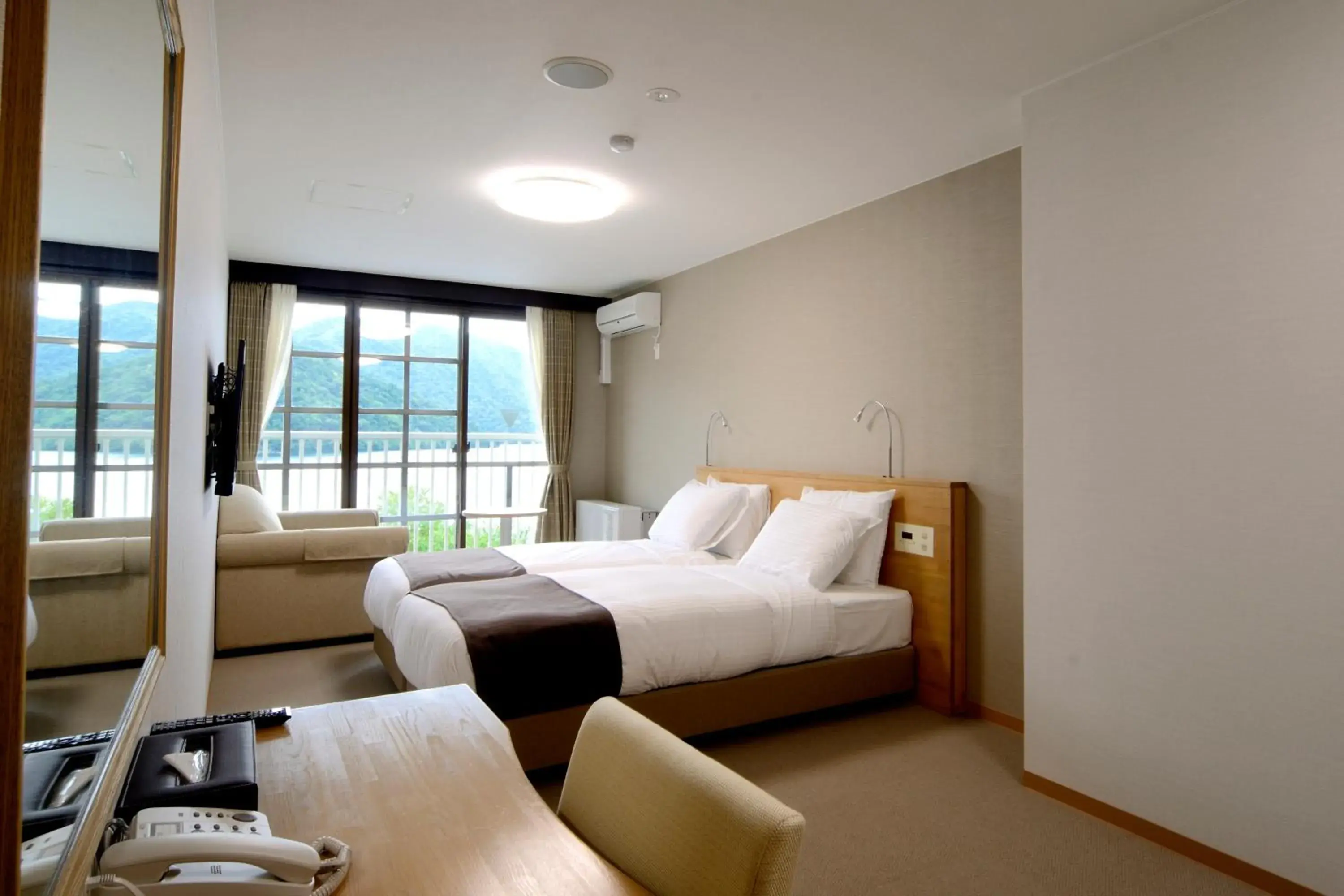 Bed in Hatago Nagomi Hot Spring Hotel