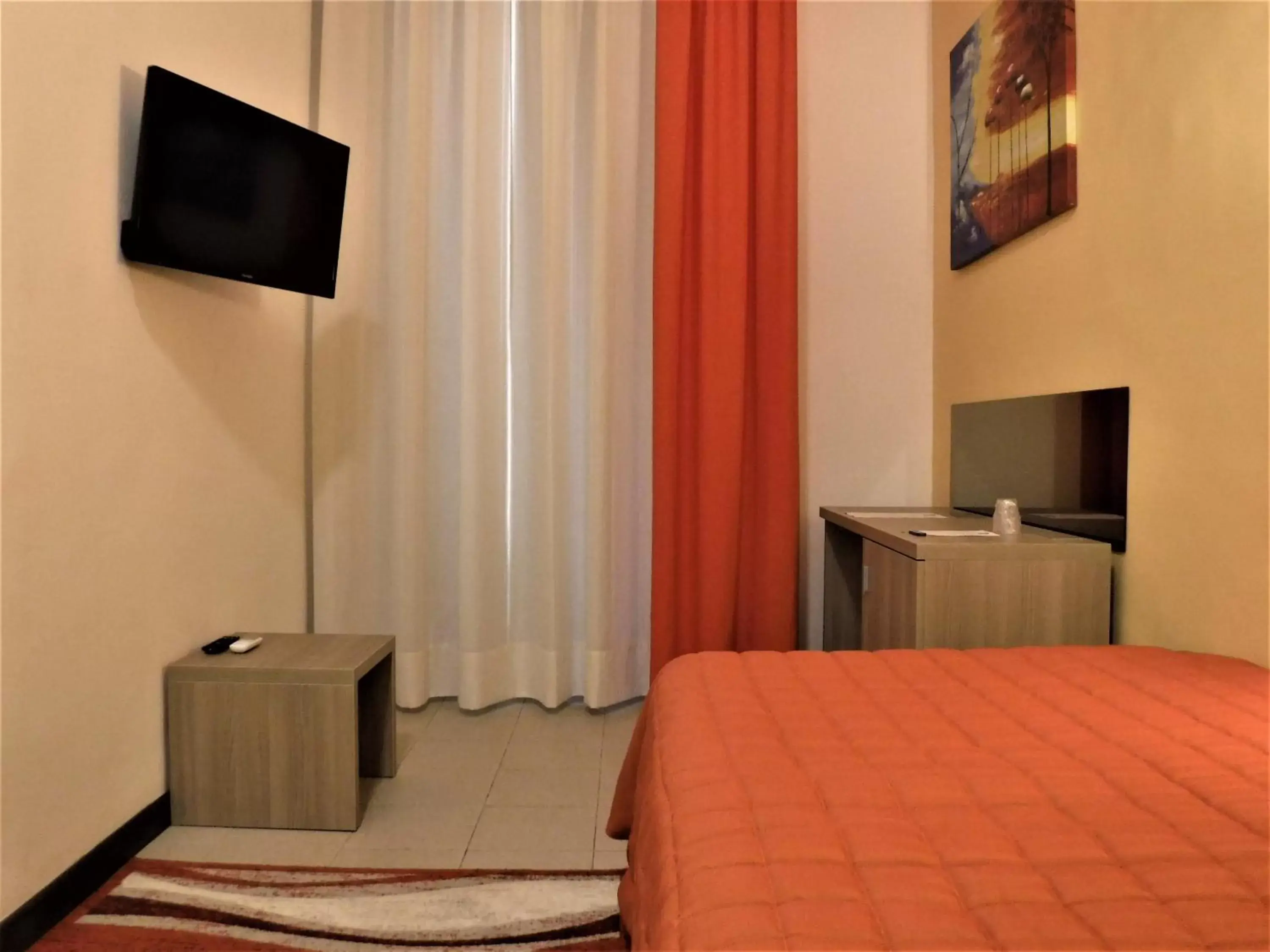 Bedroom, TV/Entertainment Center in Moonlight Hotel&Suites