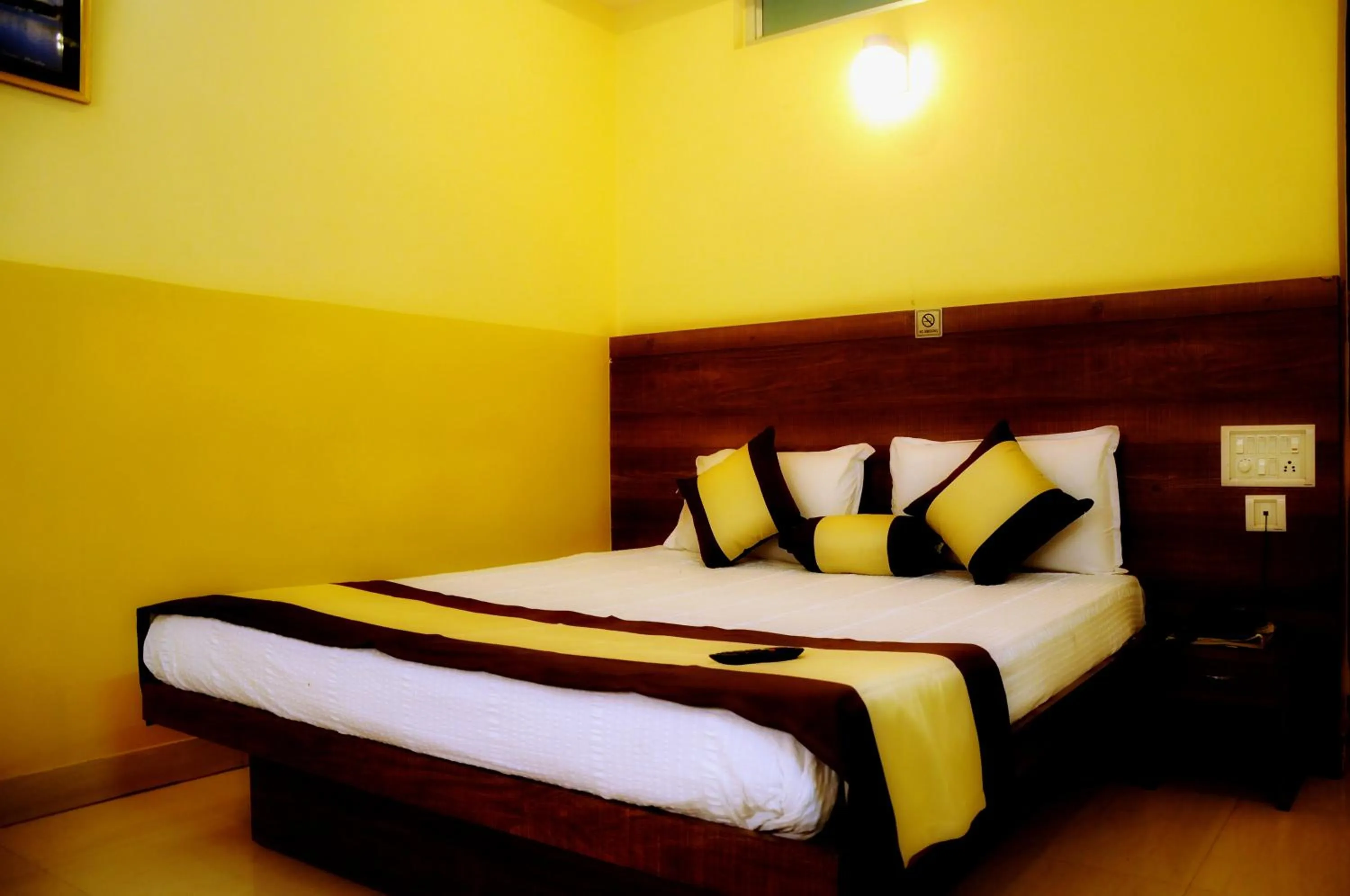 Photo of the whole room, Bed in Suvarna Residency