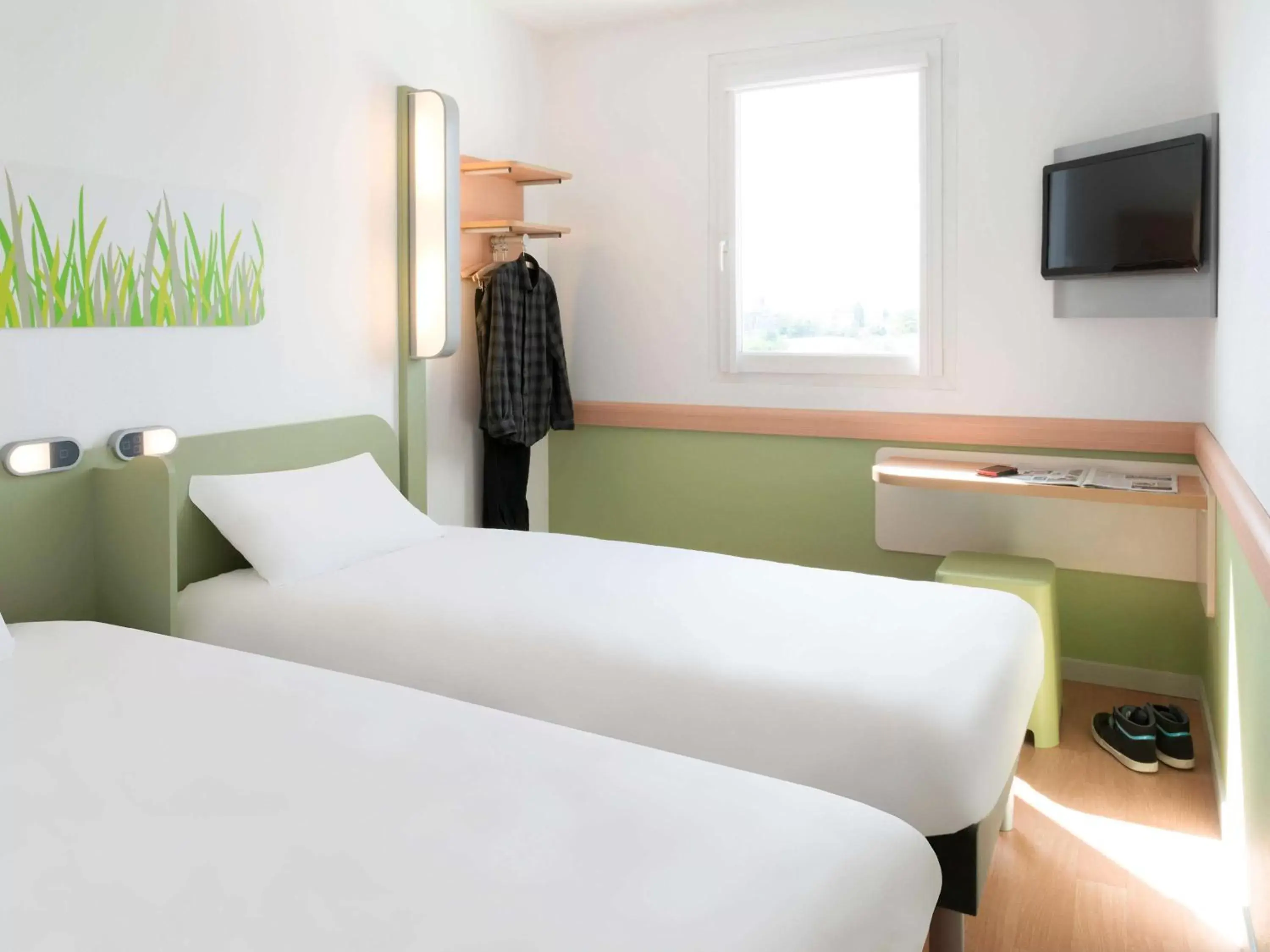 Photo of the whole room, Bed in Hotel Ibis Budget Lyon Eurexpo -