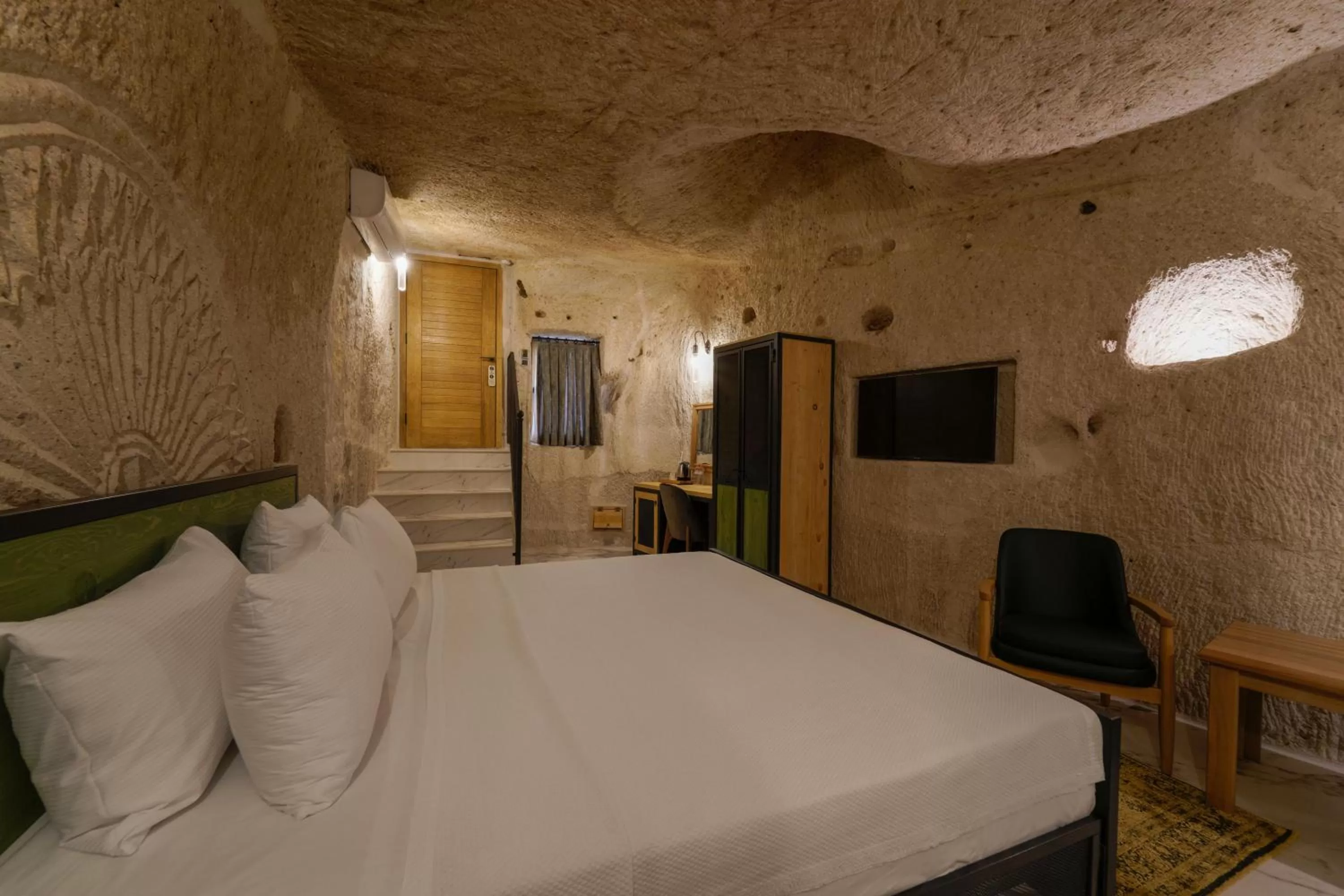 Bed in The Niche Cave Hotel