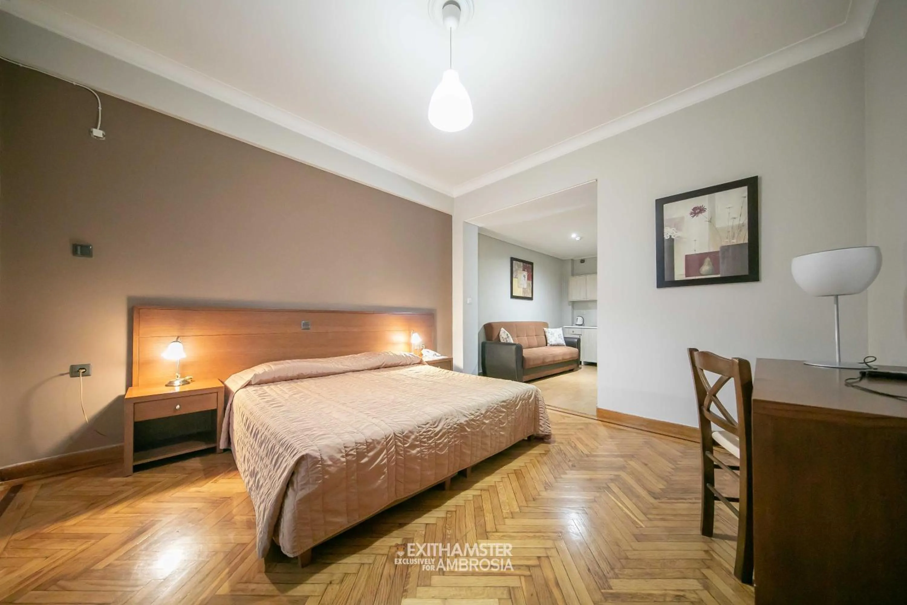 Seating area, Bed in Ambrosia Suites