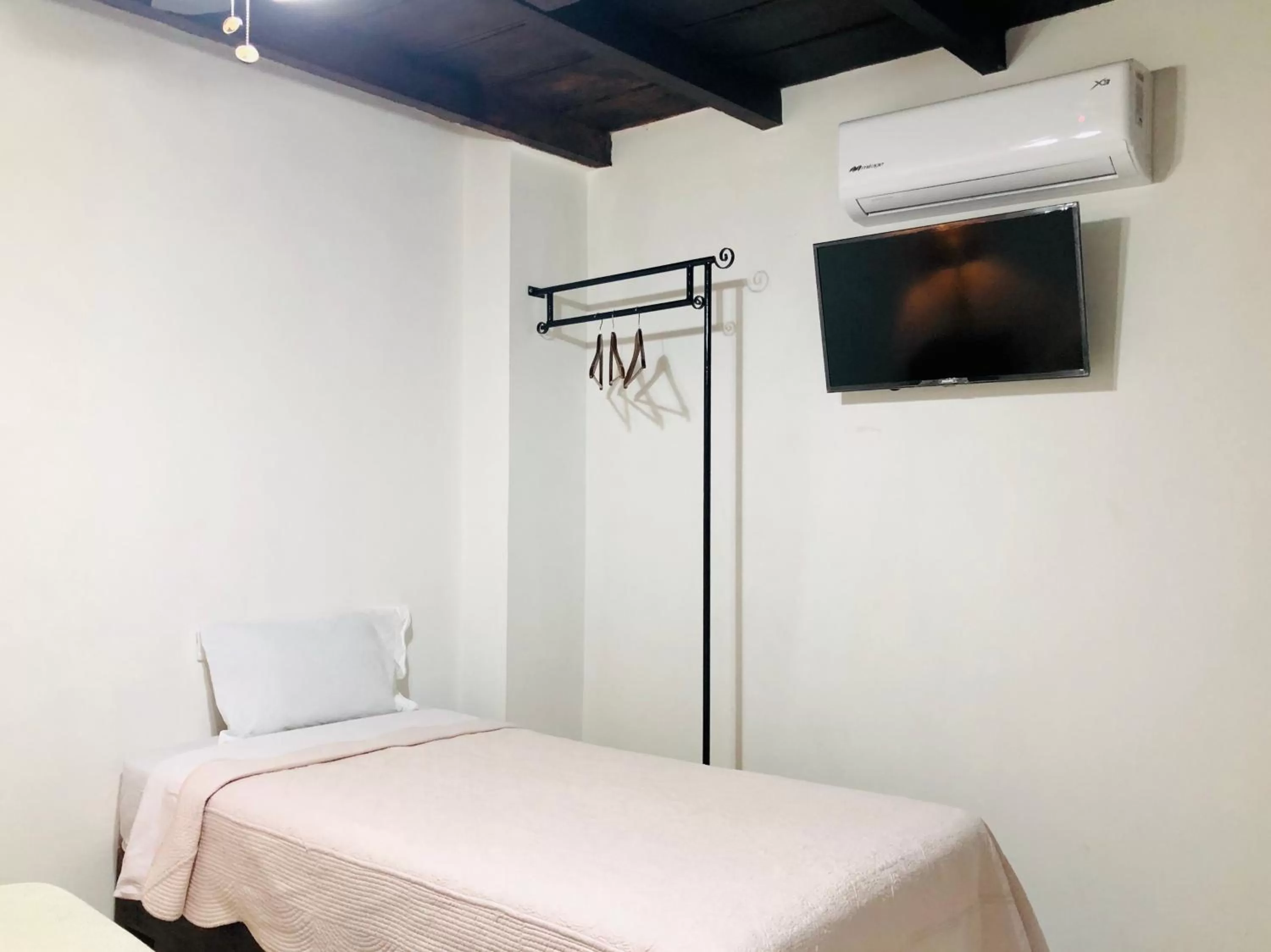 Bed in Hotel Carretas by Rotamundos