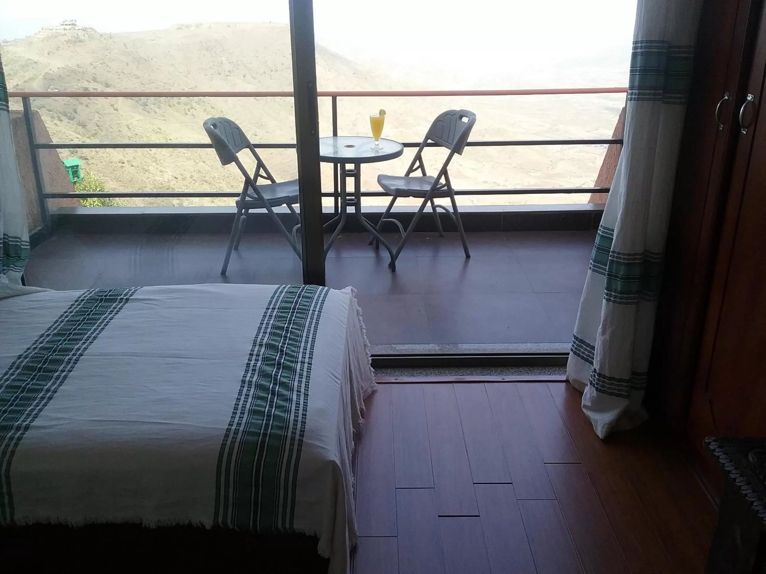 Landmark view, Bed in Panoramic View Hotel