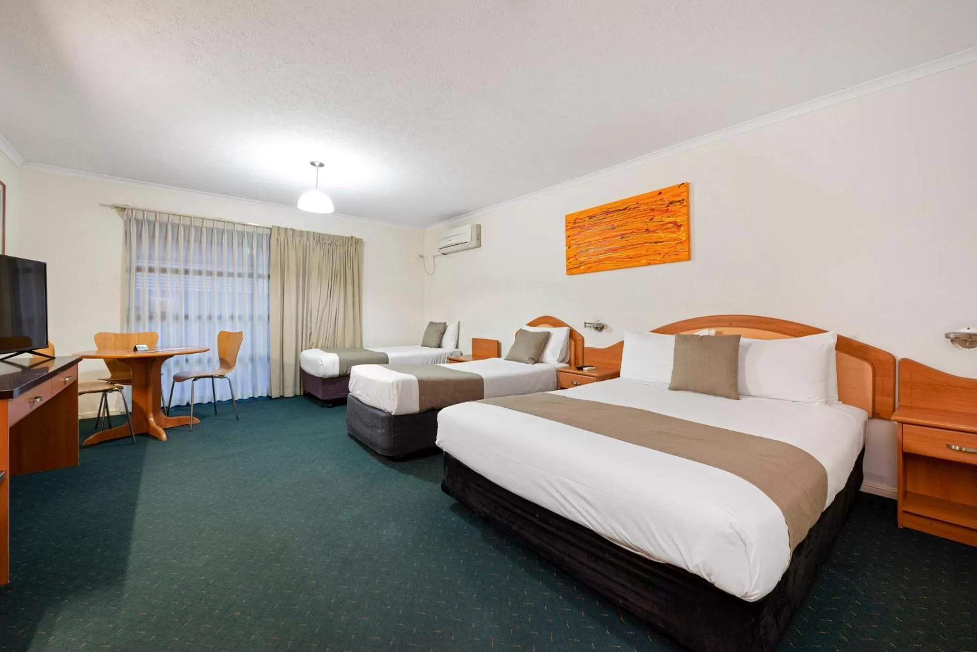 Bed in Pegasus Motor Inn and Serviced Apartments