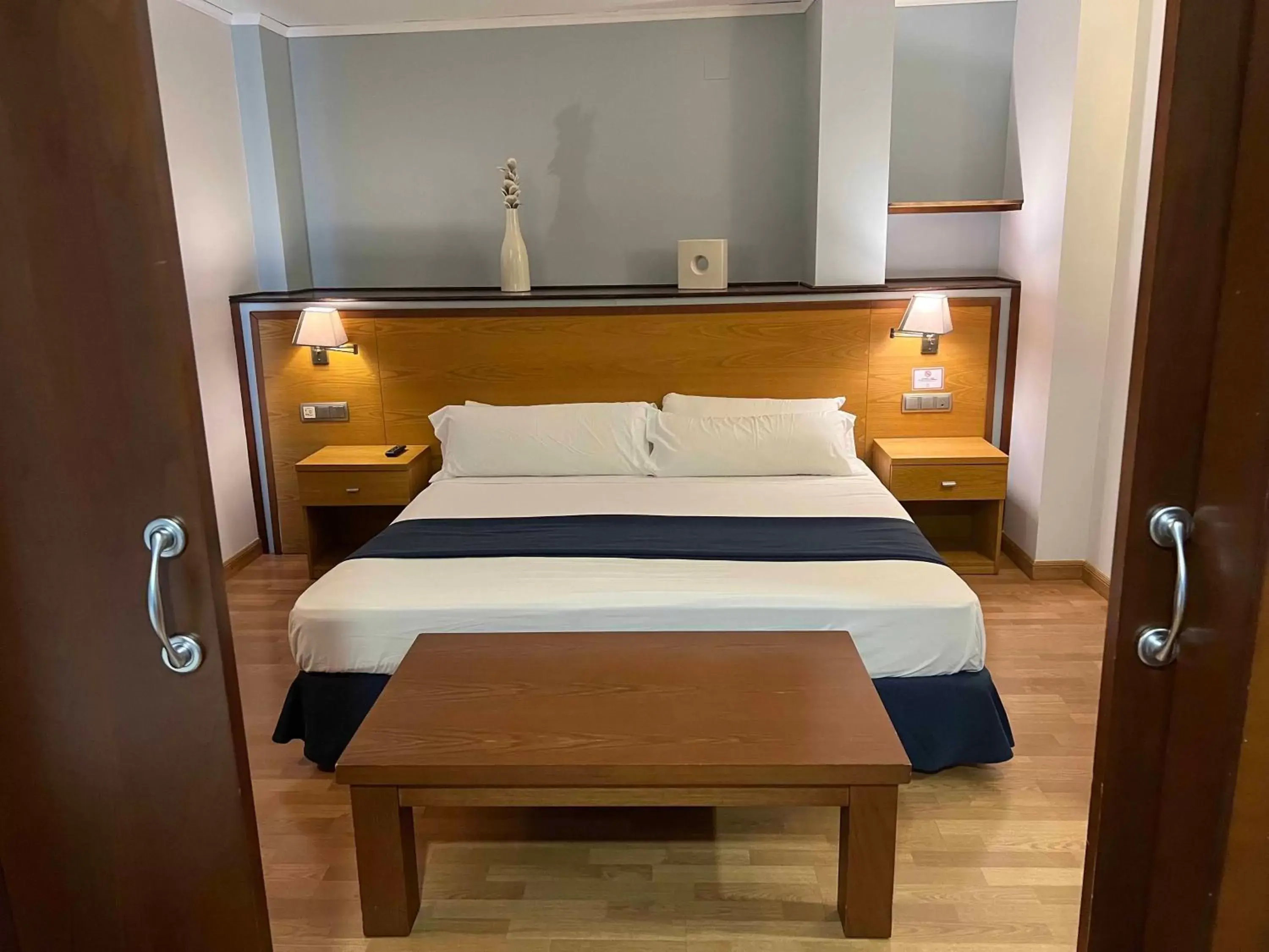 Bedroom, Bed in Alojamientos Cervantes