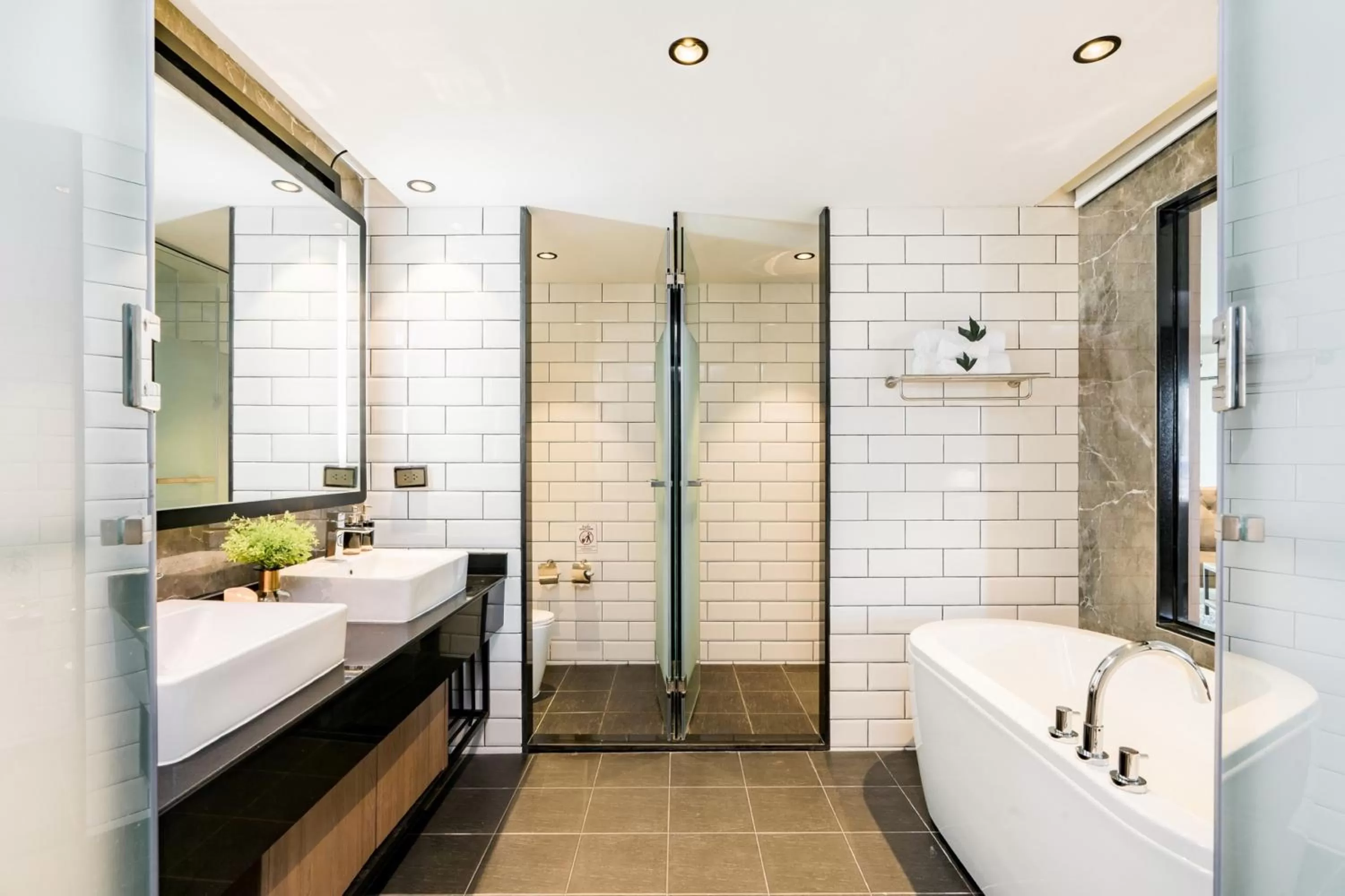 Bathroom in SureStay Plus by Best Western T Pattaya